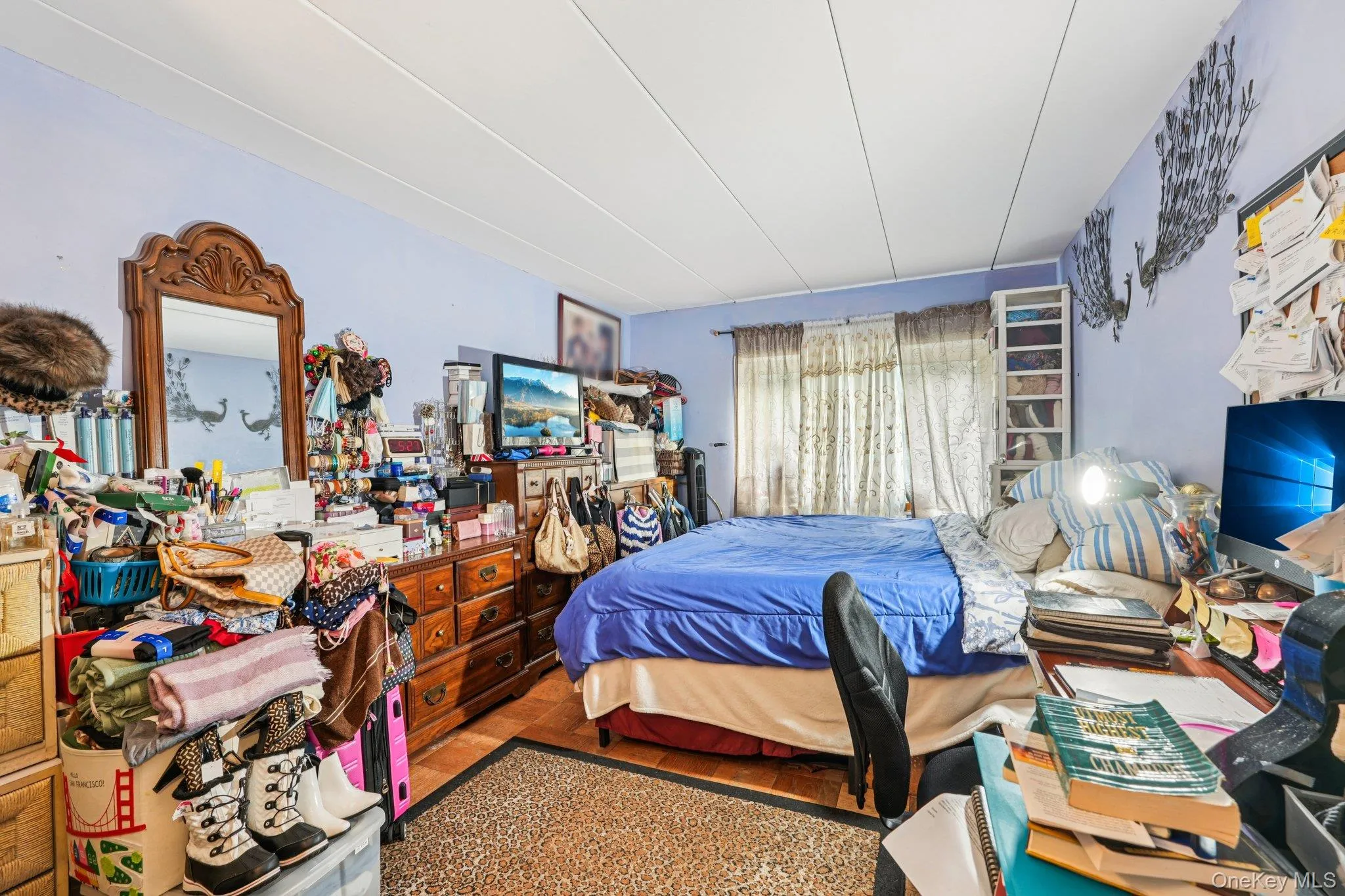 Oversized primary bedroom with deep closet storage Oversized primary bedroom with deep closet storage