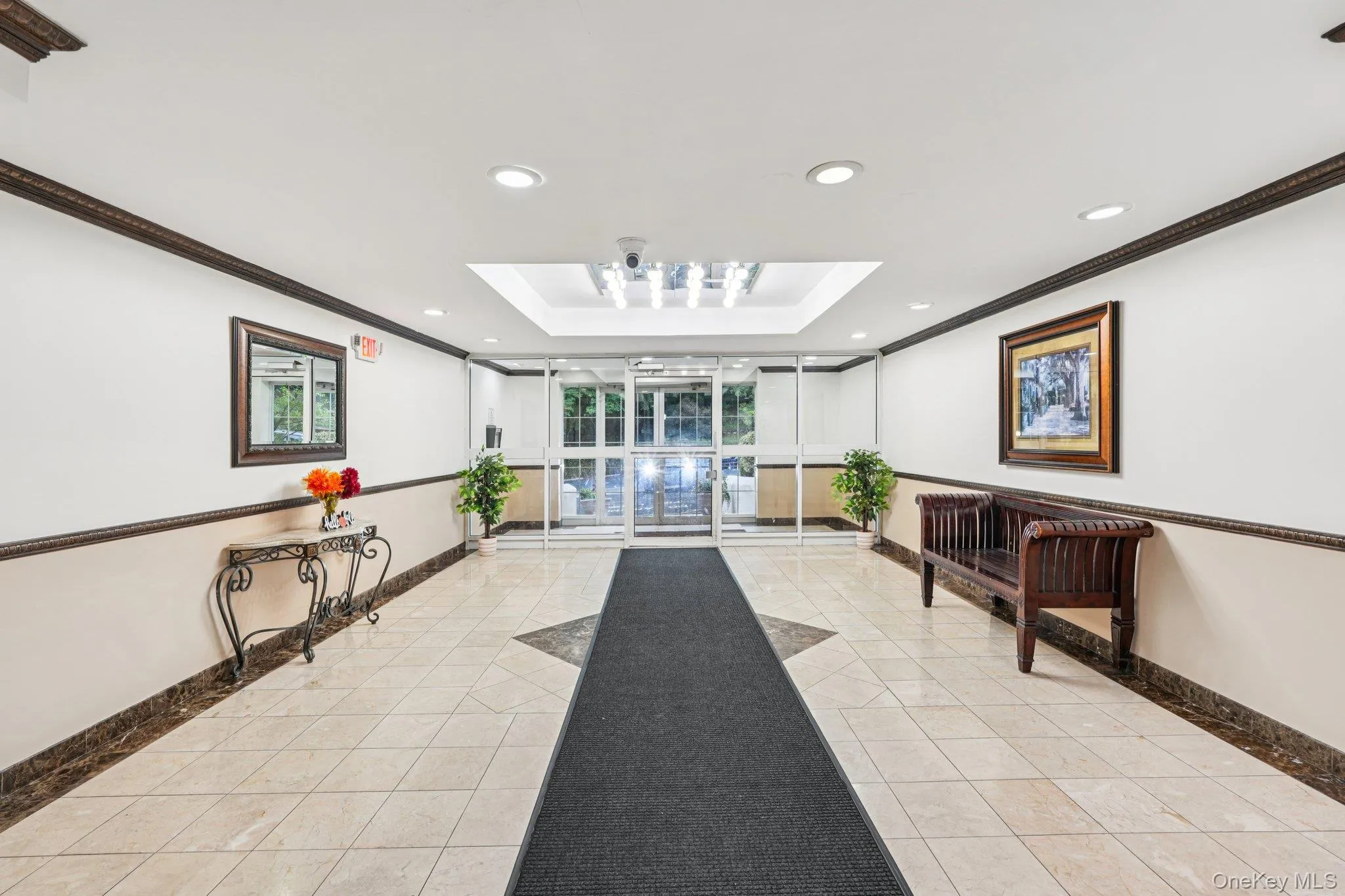 Secured lobby with crown molding, and recessed lighting Secured lobby with crown molding, and recessed lighting
