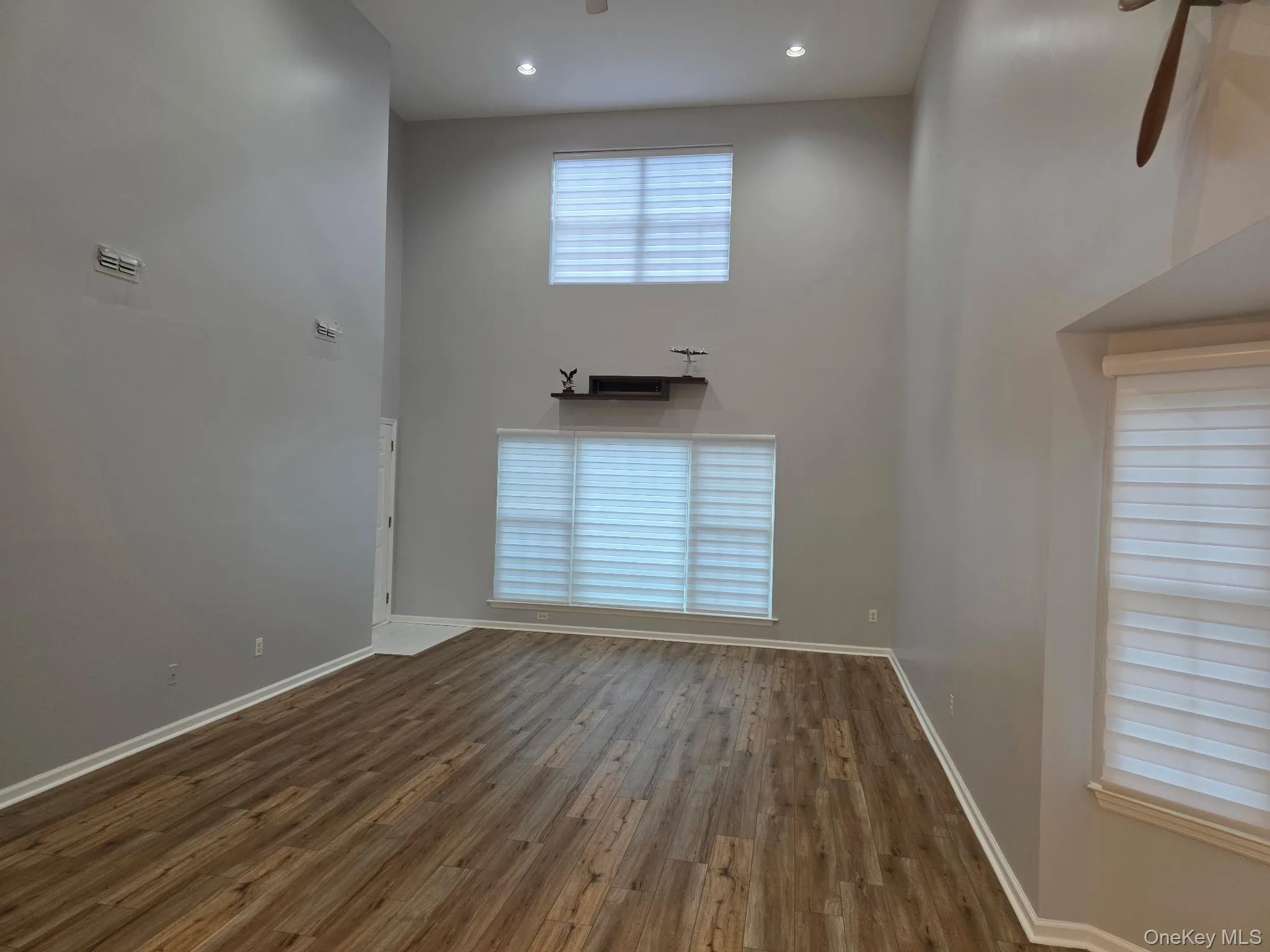 Living rm with vaulted ceilings, recessed lighting and freshly painted Living rm with vaulted ceilings, recessed lighting and freshly painted