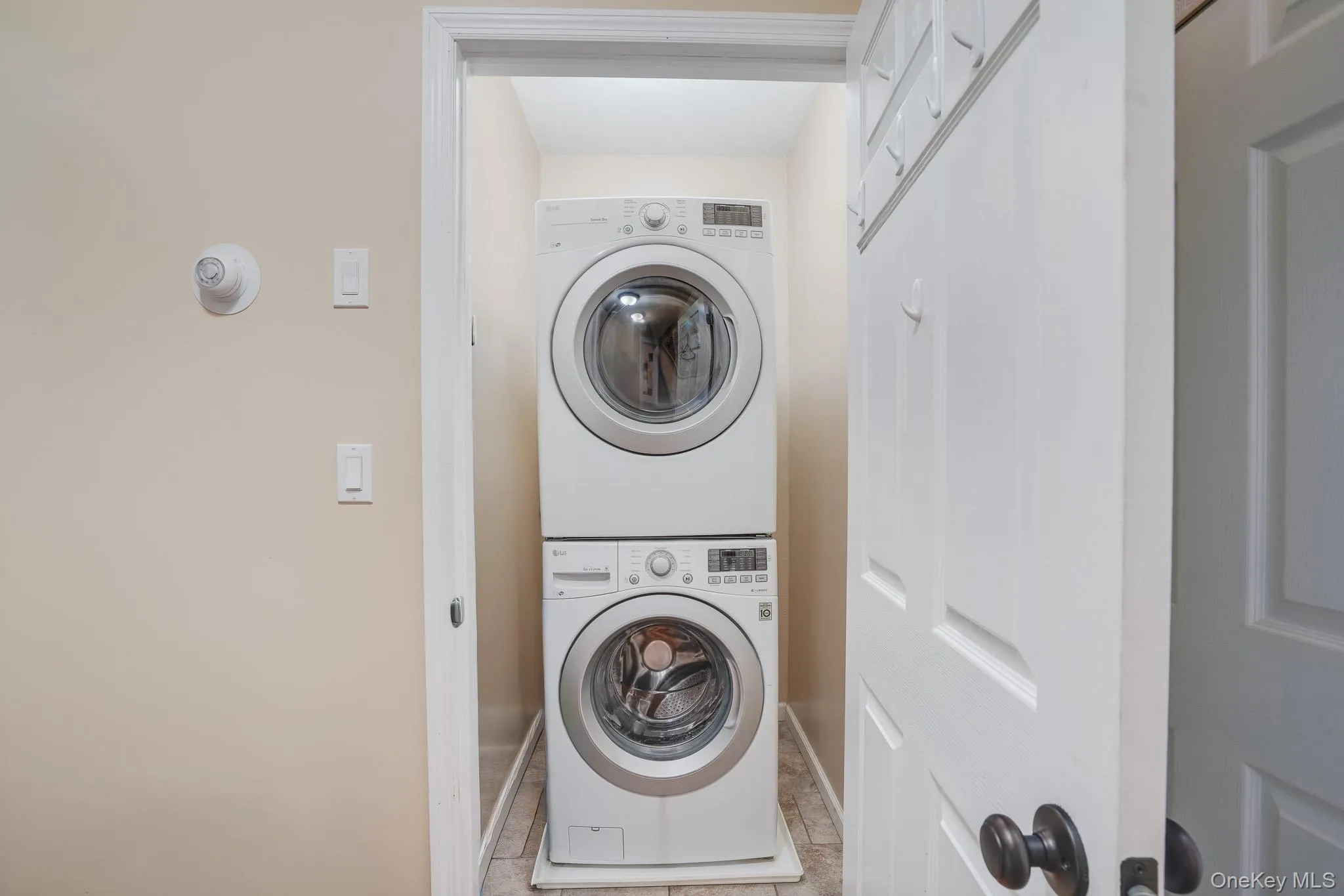 Laundry area with washer and dryer. Laundry area with washer and dryer.