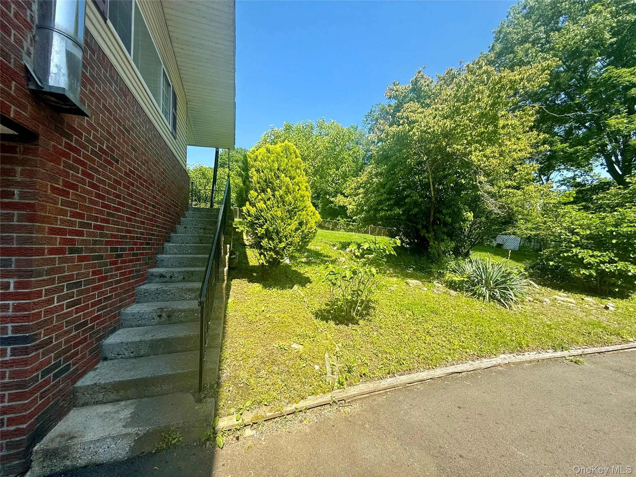 View of yard featuring stairway View of yard featuring stairway