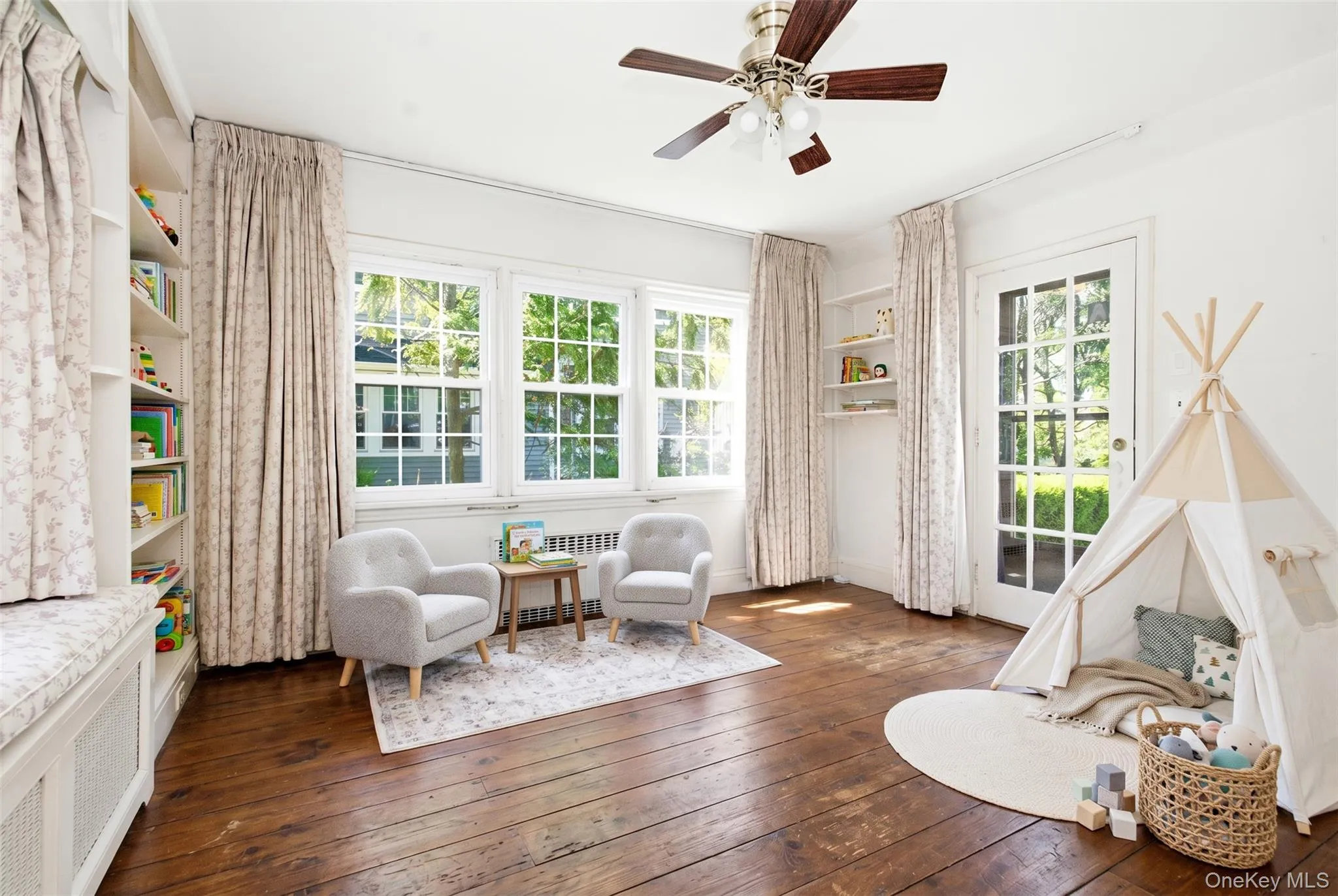 PLEASE NOTE: with my design background, I virtually reimagined this space by removing the carpet, adding hardwood flooring, and applying a fresh coat of paint to show its potential. Please continue scrolling to see the family room in its current, as-is condition. PLEASE NOTE: with my design background, I virtually reimagined this space by removing the carpet, adding hardwood flooring, and applying a fresh coat of paint to show its potential. Please continue scrolling to see the family room in its current, as-is condition.