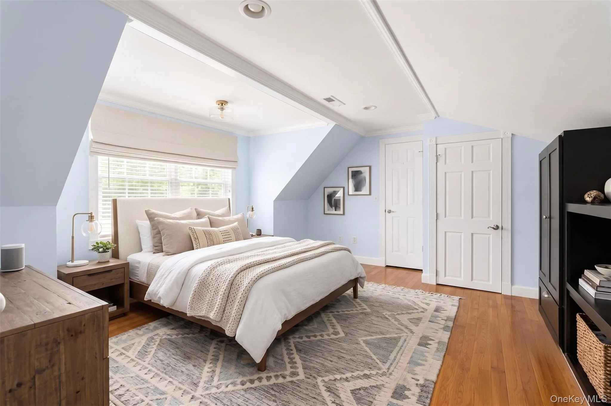 Bedroom 3 on the second level featuring hardwood flooring and a window with blinds Bedroom 3 on the second level featuring hardwood flooring and a window with blinds