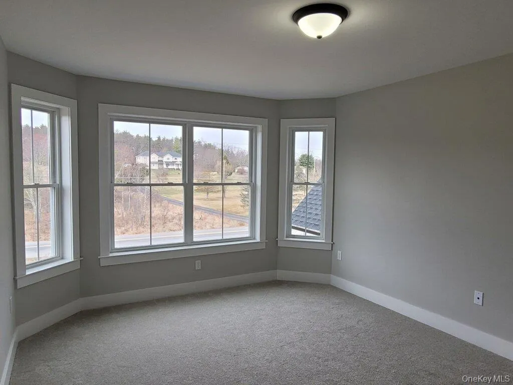 Bedroom 2 features an inviting bay window that fills the room with light and added architectural character. Bedroom 2 features an inviting bay window that fills the room with light and added architectural character.