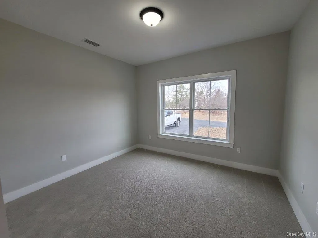 Spacious bedroom provides ample room for a full furniture arrangement offering comfort and versatility. Spacious bedroom provides ample room for a full furniture arrangement offering comfort and versatility.