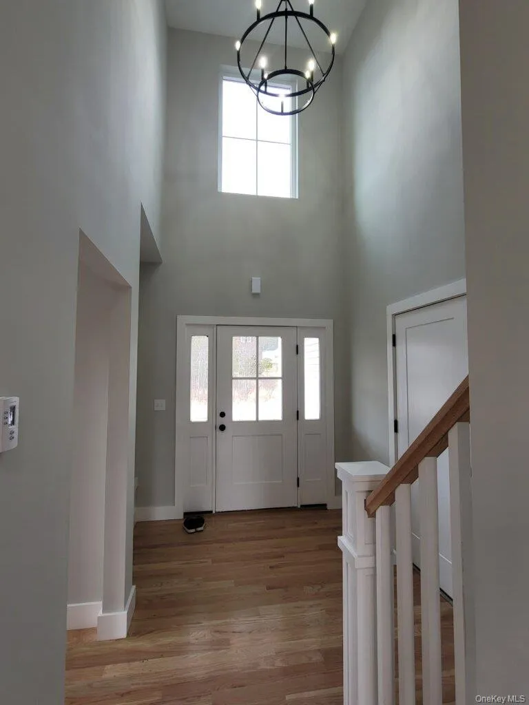 Bright, welcoming foyer offering an impressive introduction with soaring ceilings and an open view into the heart of the home. Bright, welcoming foyer offering an impressive introduction with soaring ceilings and an open view into the heart of the home.