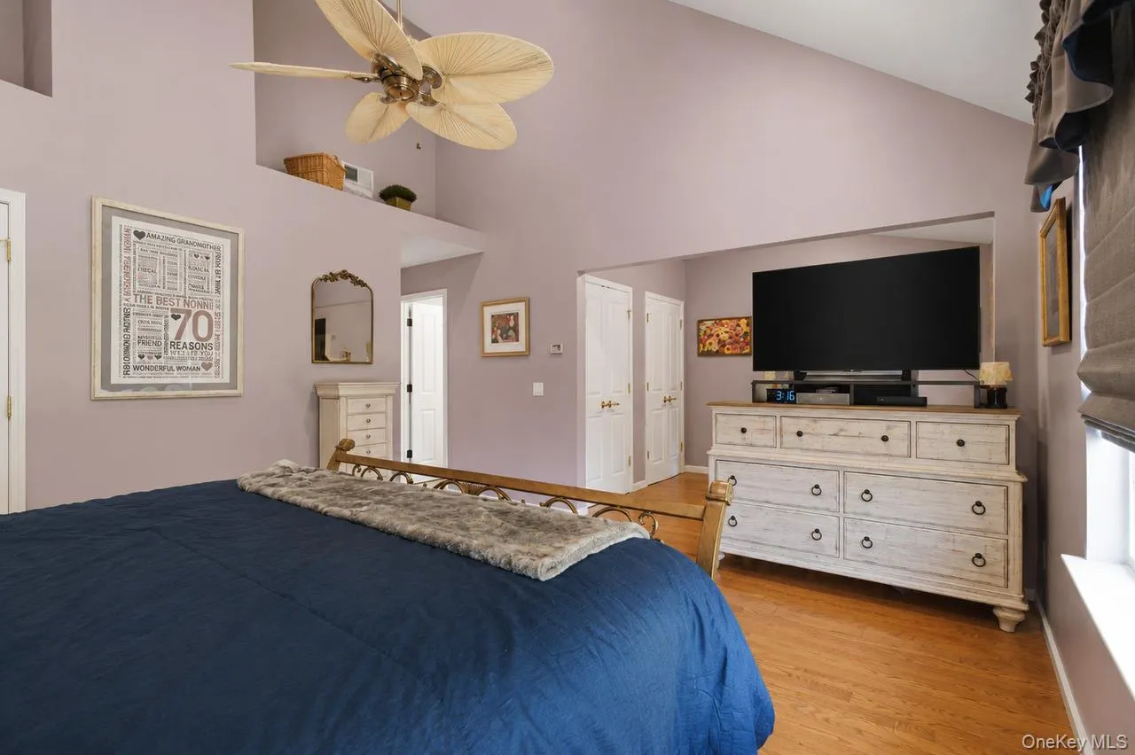 Spacious room with vaulted ceilings and a ceiling fan Spacious room with vaulted ceilings and a ceiling fan