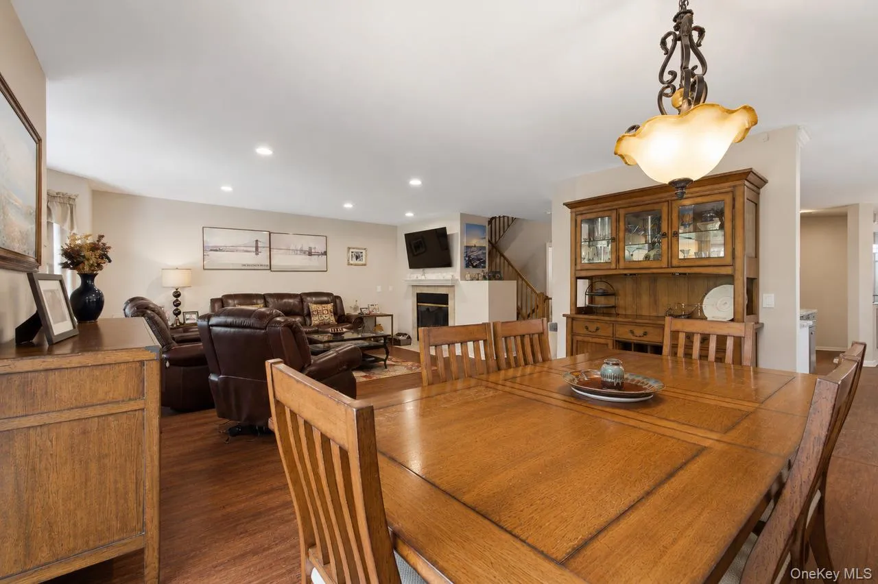 Dining area featuring a decorative chandelier with an alabaster-style shade Dining area featuring a decorative chandelier with an alabaster-style shade