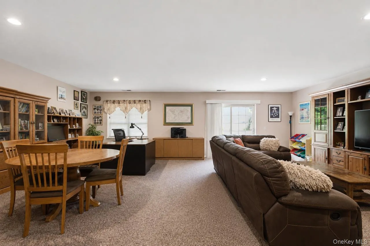 Open-concept room featuring neutral carpeting and recessed lighting Open-concept room featuring neutral carpeting and recessed lighting