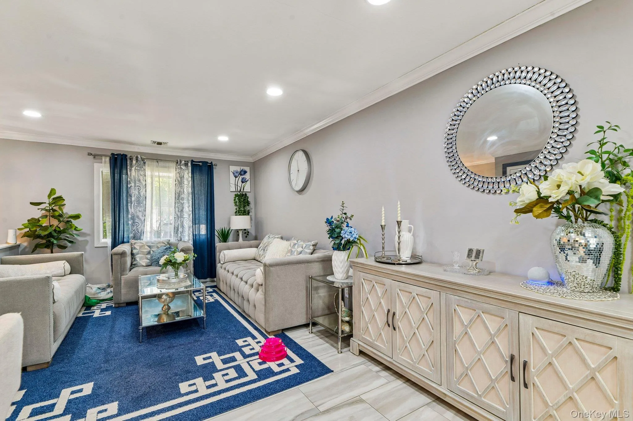 Spacious living area featuring recessed lighting and light-toned walls Spacious living area featuring recessed lighting and light-toned walls