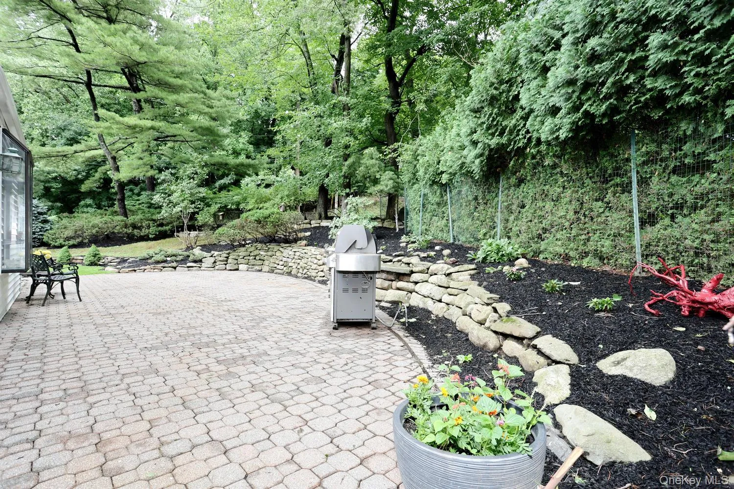 Great paver patio with entry to kitchen, stonewalls and gas line to BBQ! Great paver patio with entry to kitchen, stonewalls and gas line to BBQ!