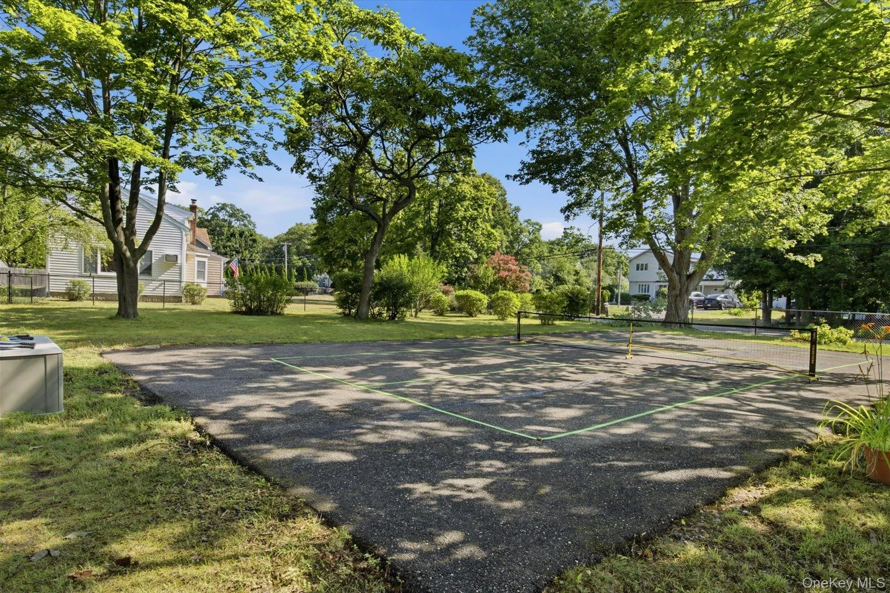 Private Pickleball court on side yard Private Pickleball court on side yard