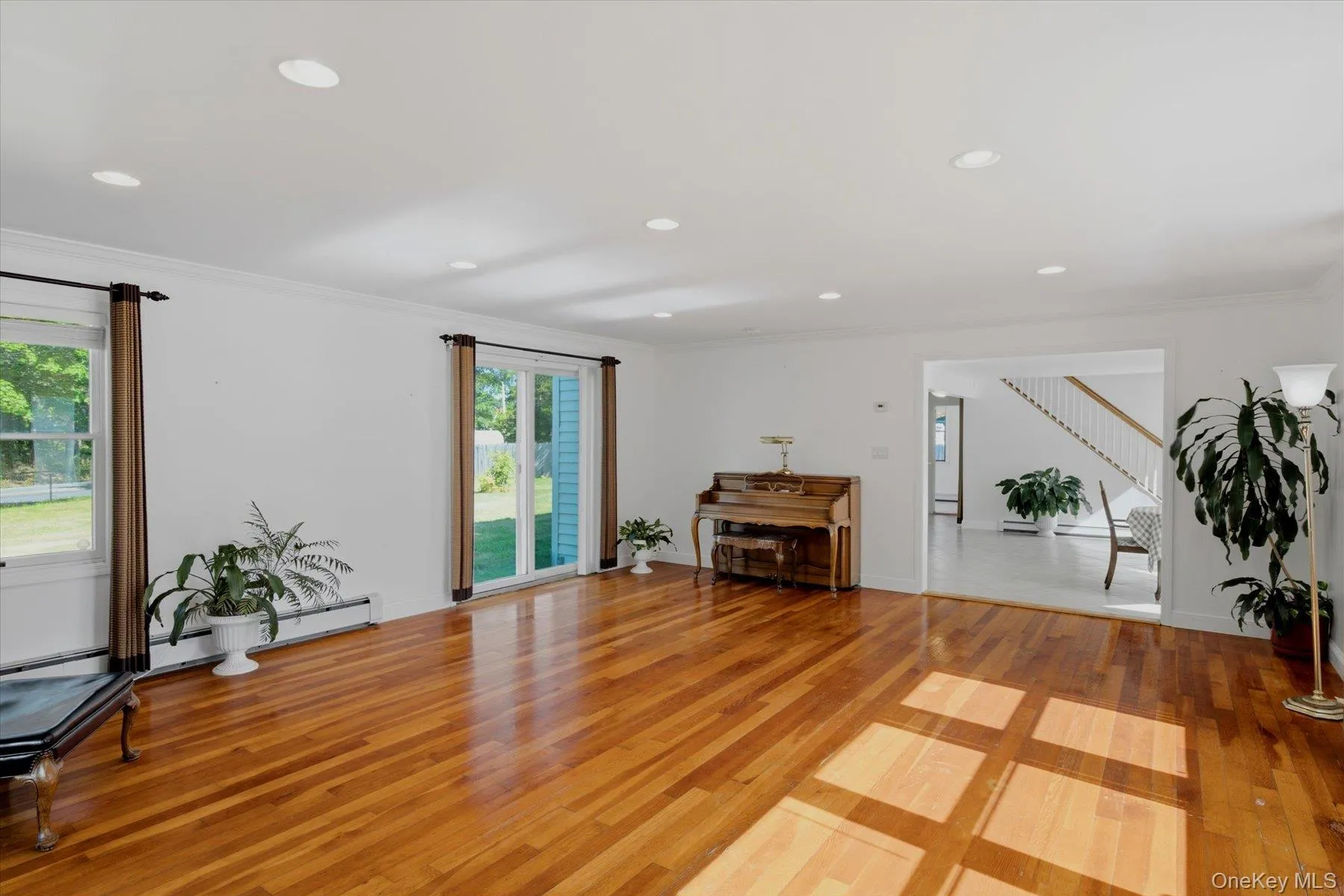 Gleaming Hardwood floors, Tons of large anderson windows to make this a well naturally lite family room Gleaming Hardwood floors, Tons of large anderson windows to make this a well naturally lite family room