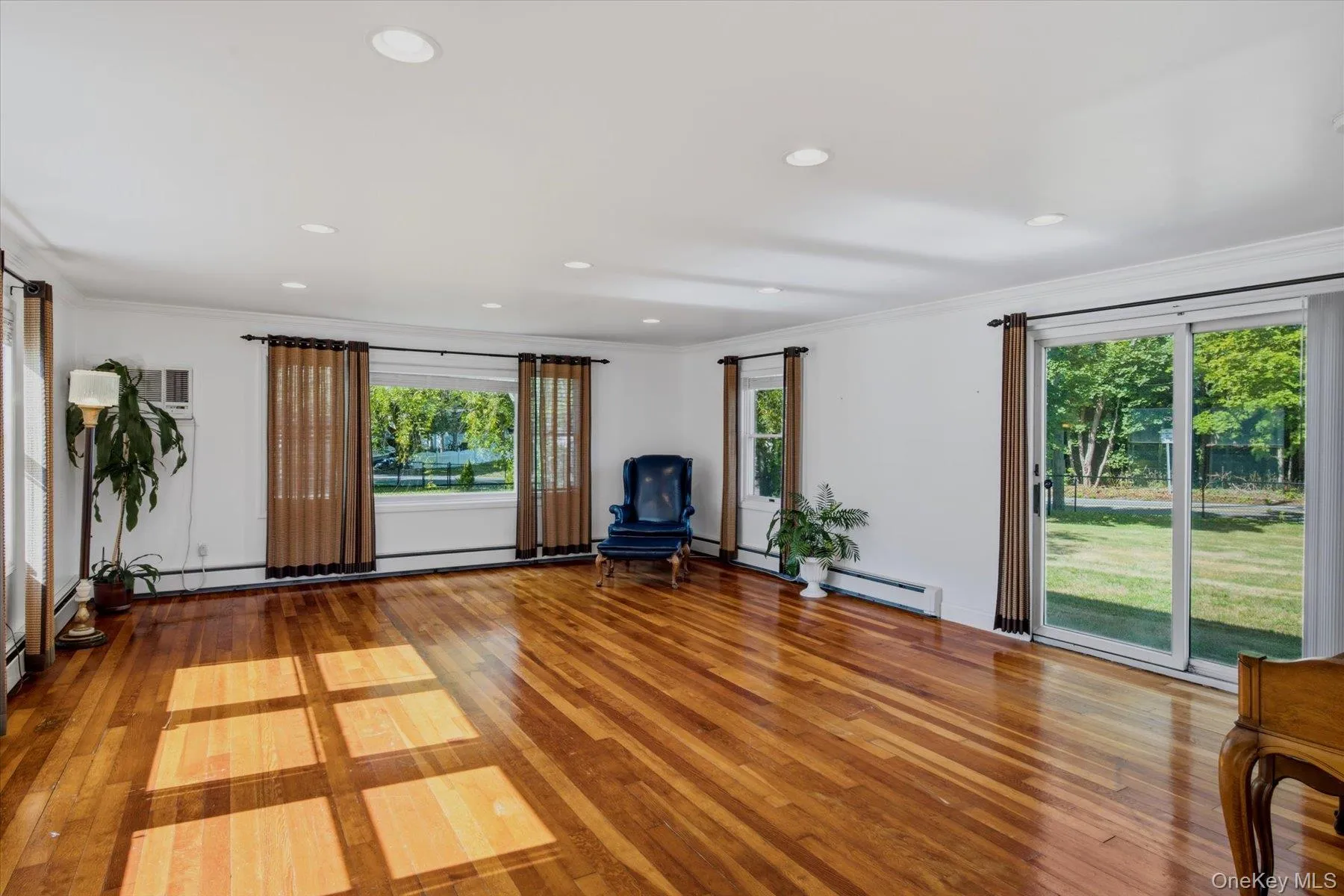 Beautiful large family room filled with natural light. Beautiful large family room filled with natural light.