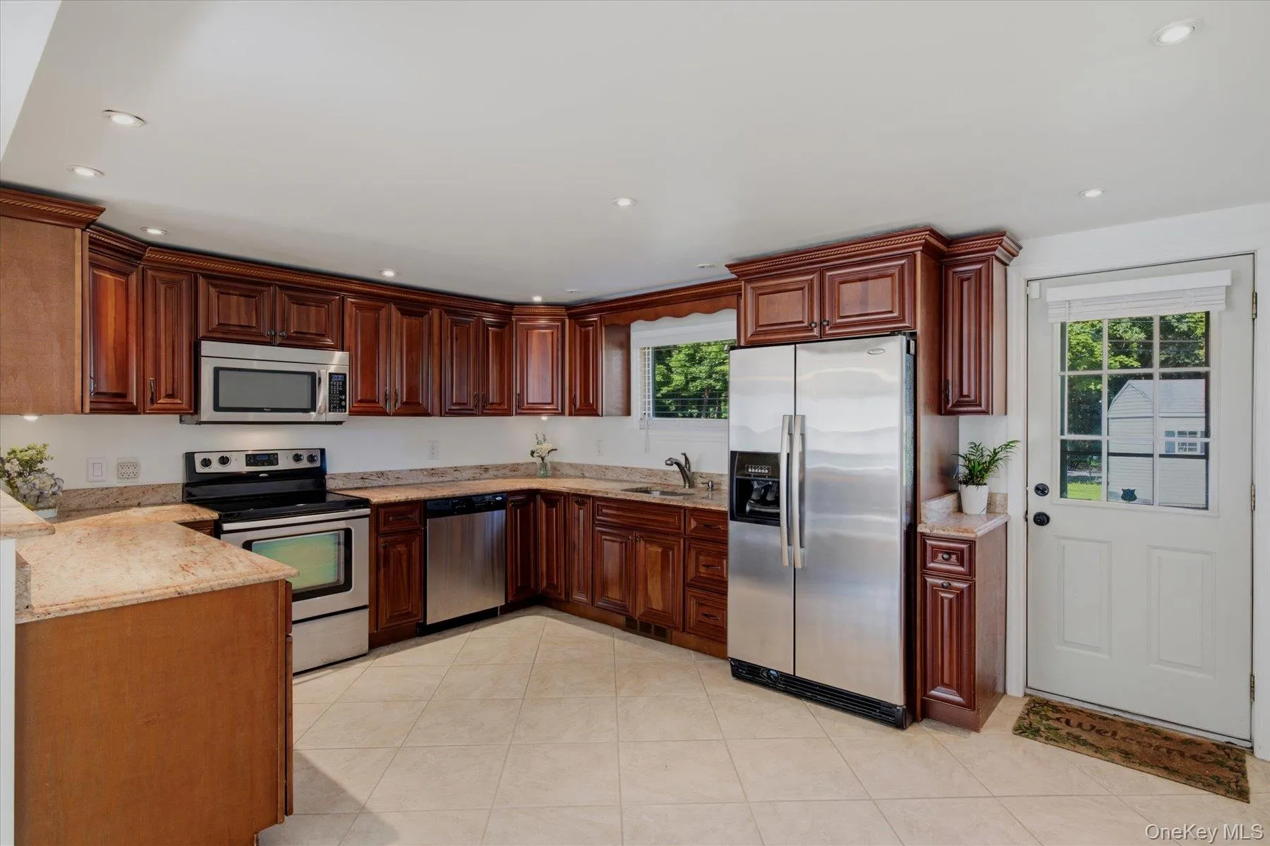Gorgeous cherry cabinetry, granite countertops and stainless steel appliances. Gorgeous cherry cabinetry, granite countertops and stainless steel appliances.
