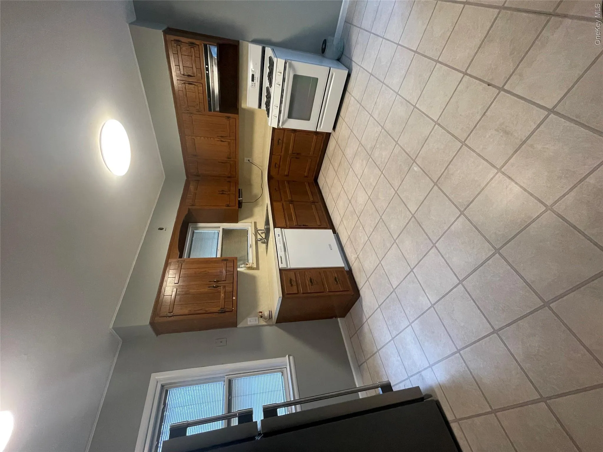 Kitchen with refrigerator, range hood, stove, a sink, and dishwasher Kitchen with refrigerator, range hood, stove, a sink, and dishwasher