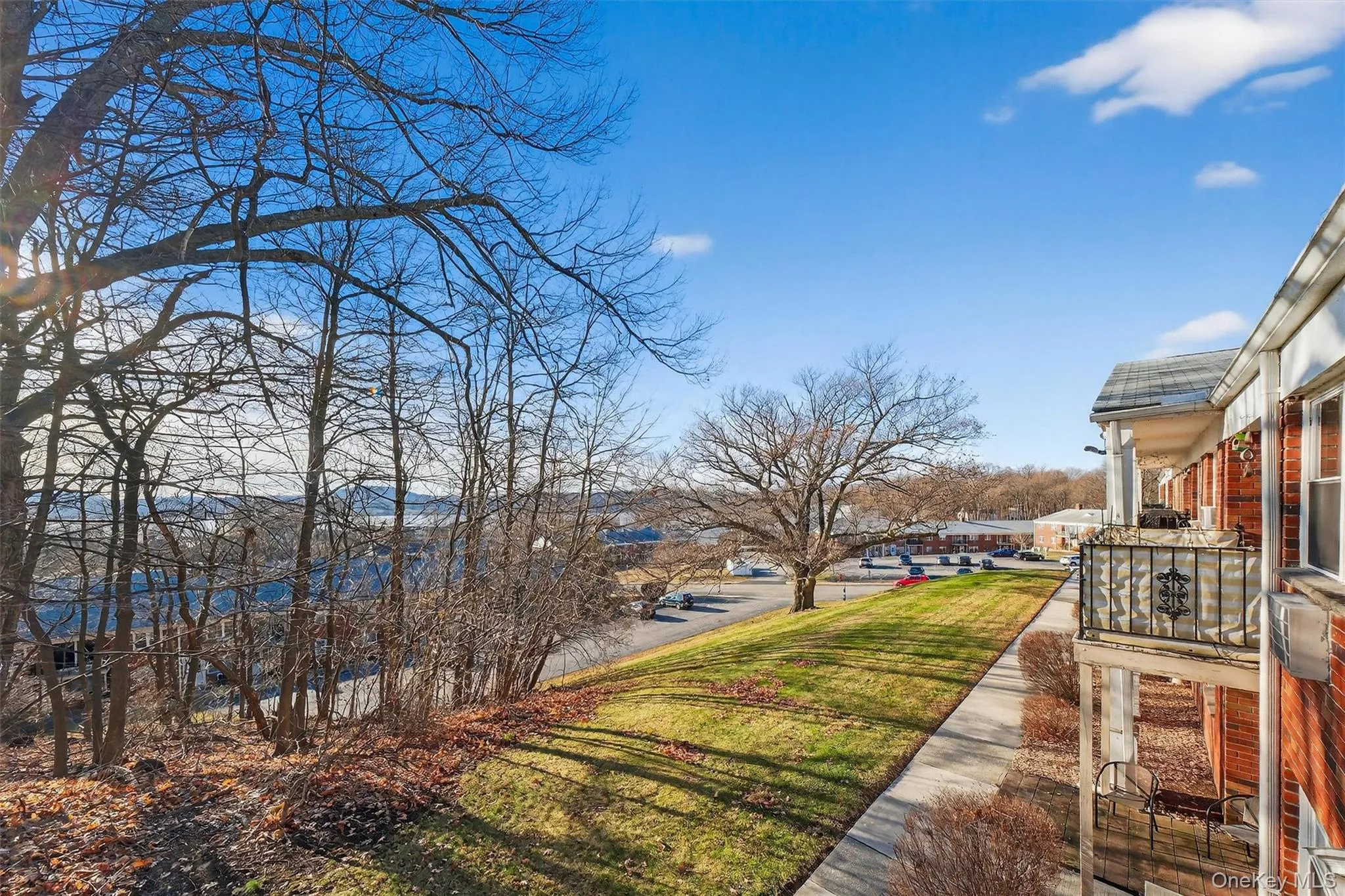 View of green lawn featuring a residential view View of green lawn featuring a residential view