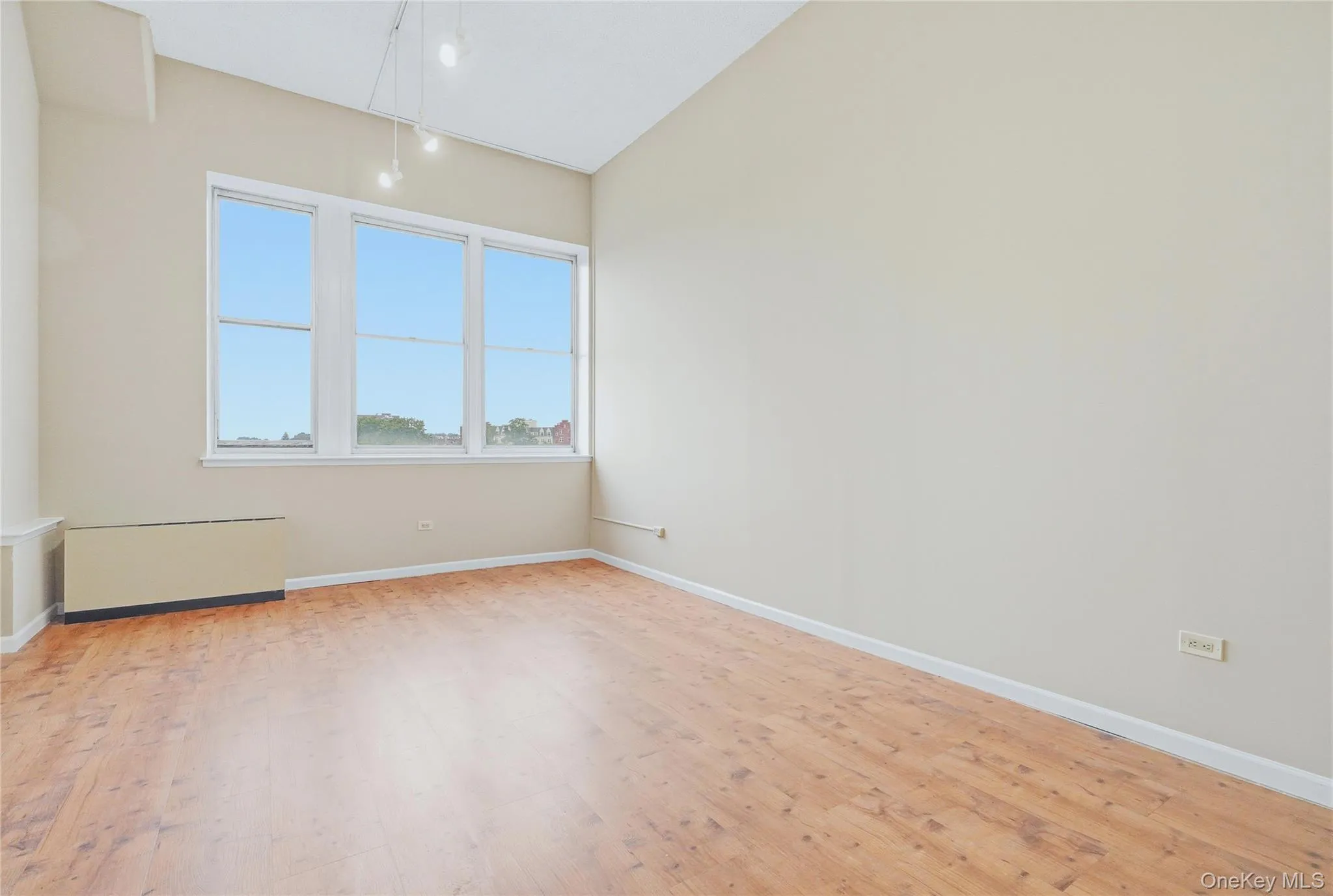 large bright living room with wood/ parquet floors. large bright living room with wood/ parquet floors.