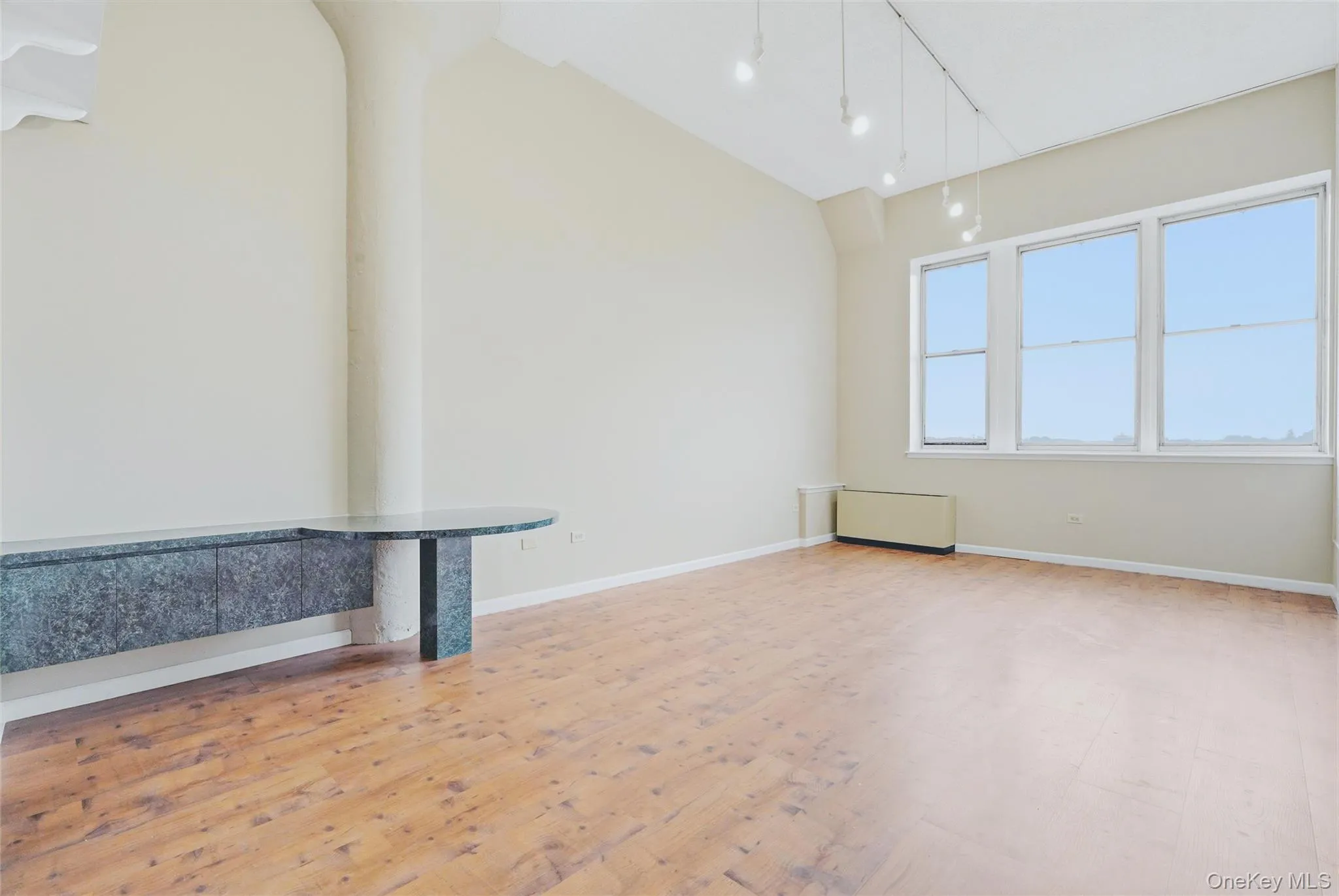 Large living room with soaring ceilings. Large living room with soaring ceilings.