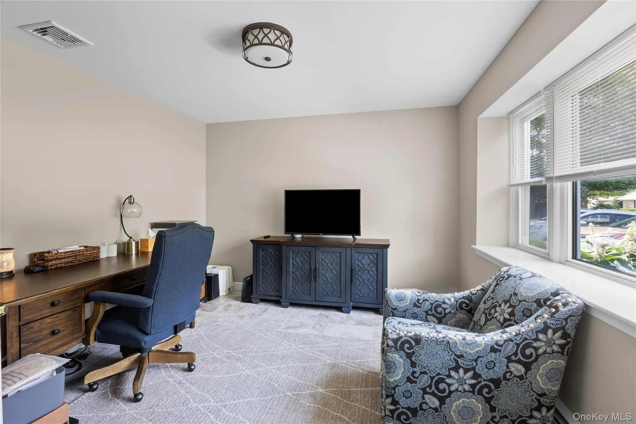 Neutral-toned walls complement the light-toned patterned carpeting Neutral-toned walls complement the light-toned patterned carpeting