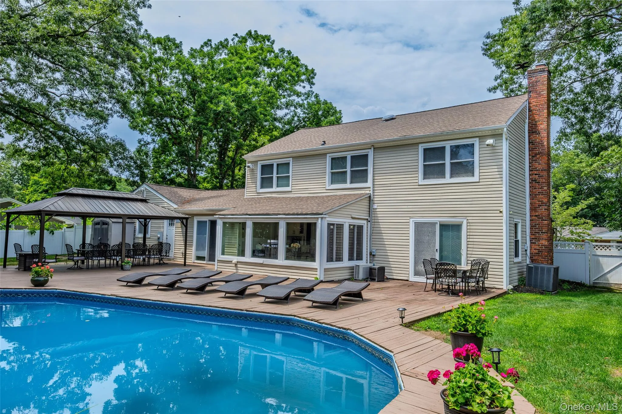 Swimming pool with an expansive surrounding deck Swimming pool with an expansive surrounding deck