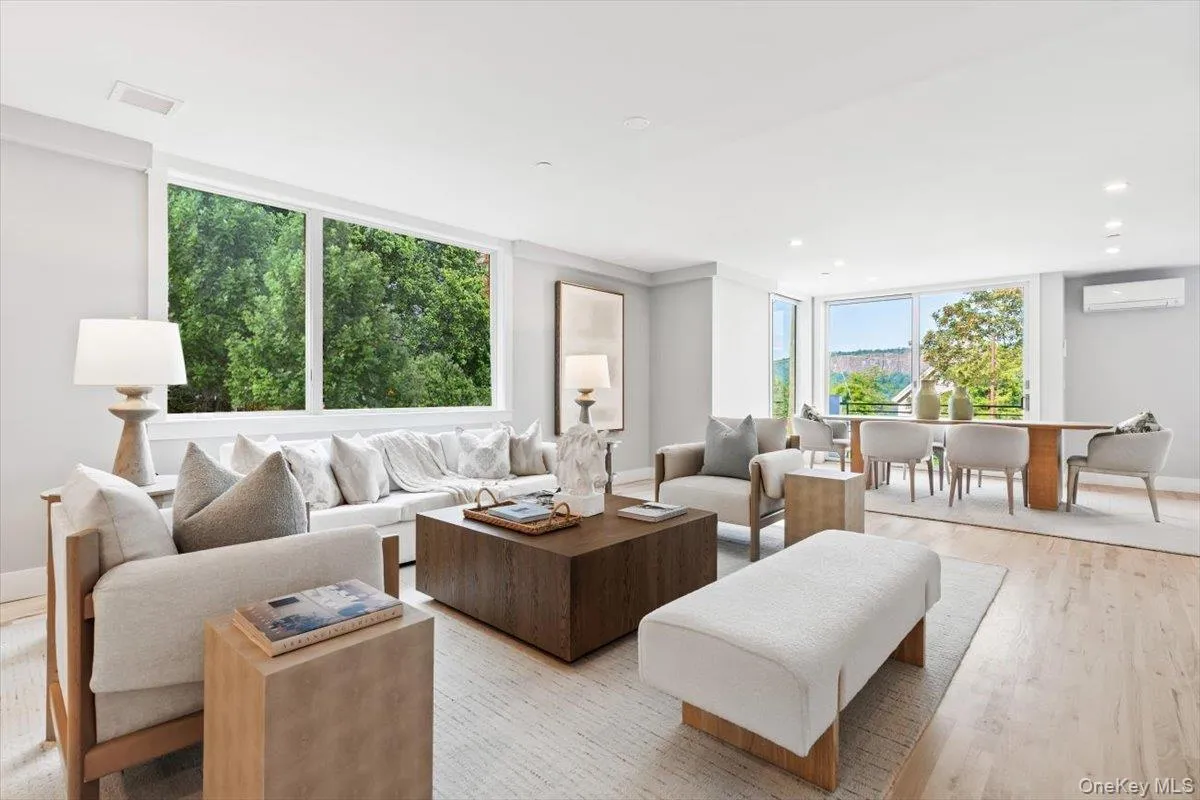 Sun-drenched, open-concept main level perfectly blending the living and dining areas. Sun-drenched, open-concept main level perfectly blending the living and dining areas.