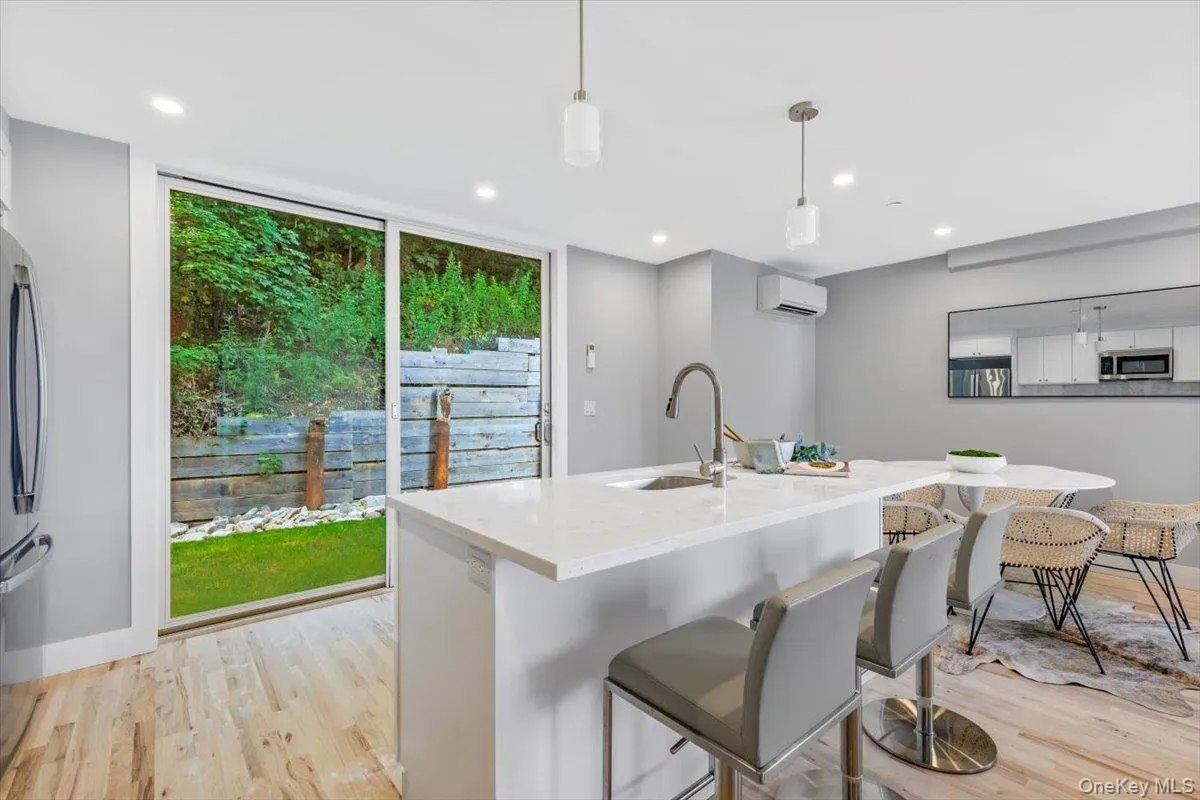 Bright kitchen workspace with direct glass slider access to your private outdoor retreat. Bright kitchen workspace with direct glass slider access to your private outdoor retreat.