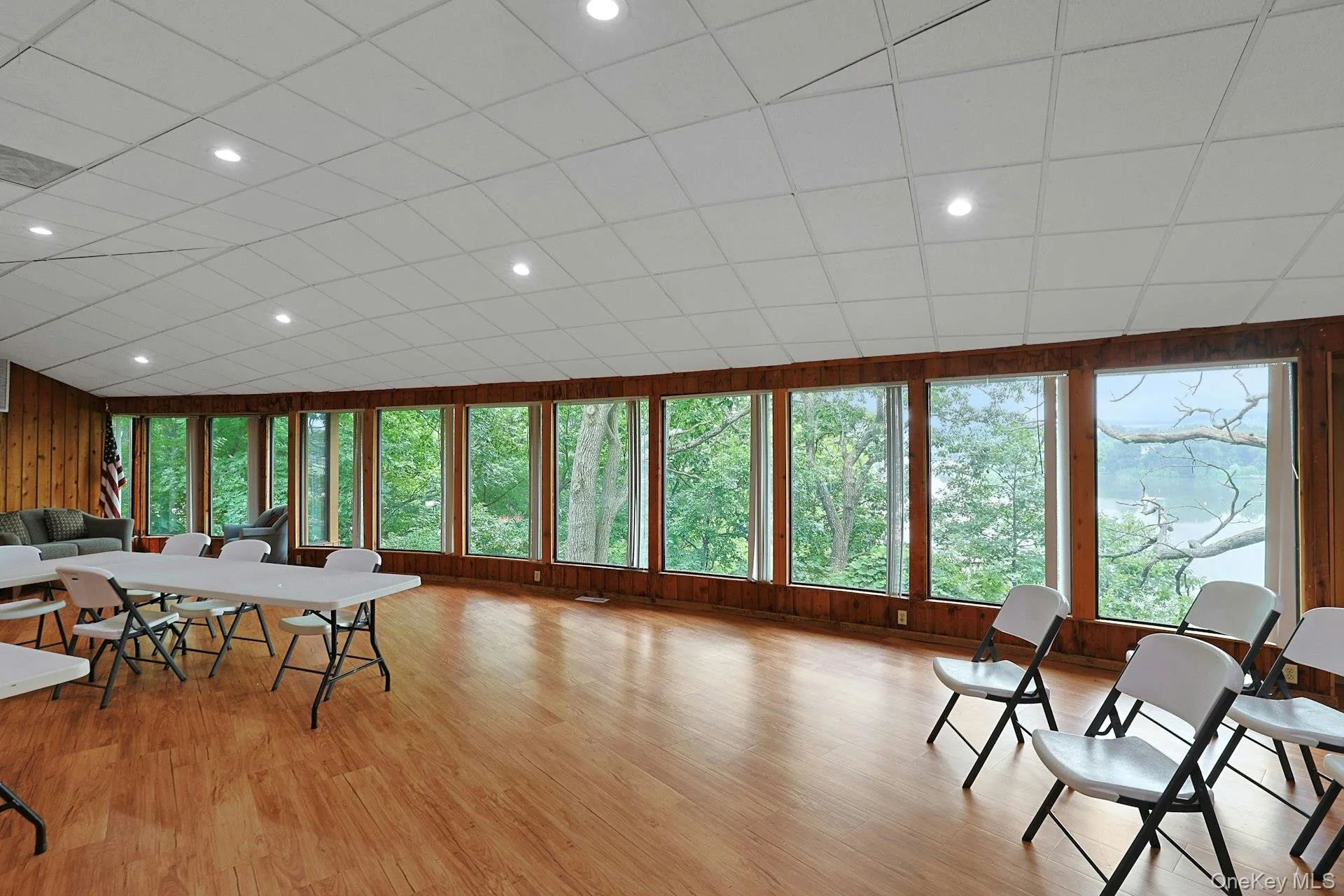 Walls of windows offer natural light in the community clubhouse. Walls of windows offer natural light in the community clubhouse.