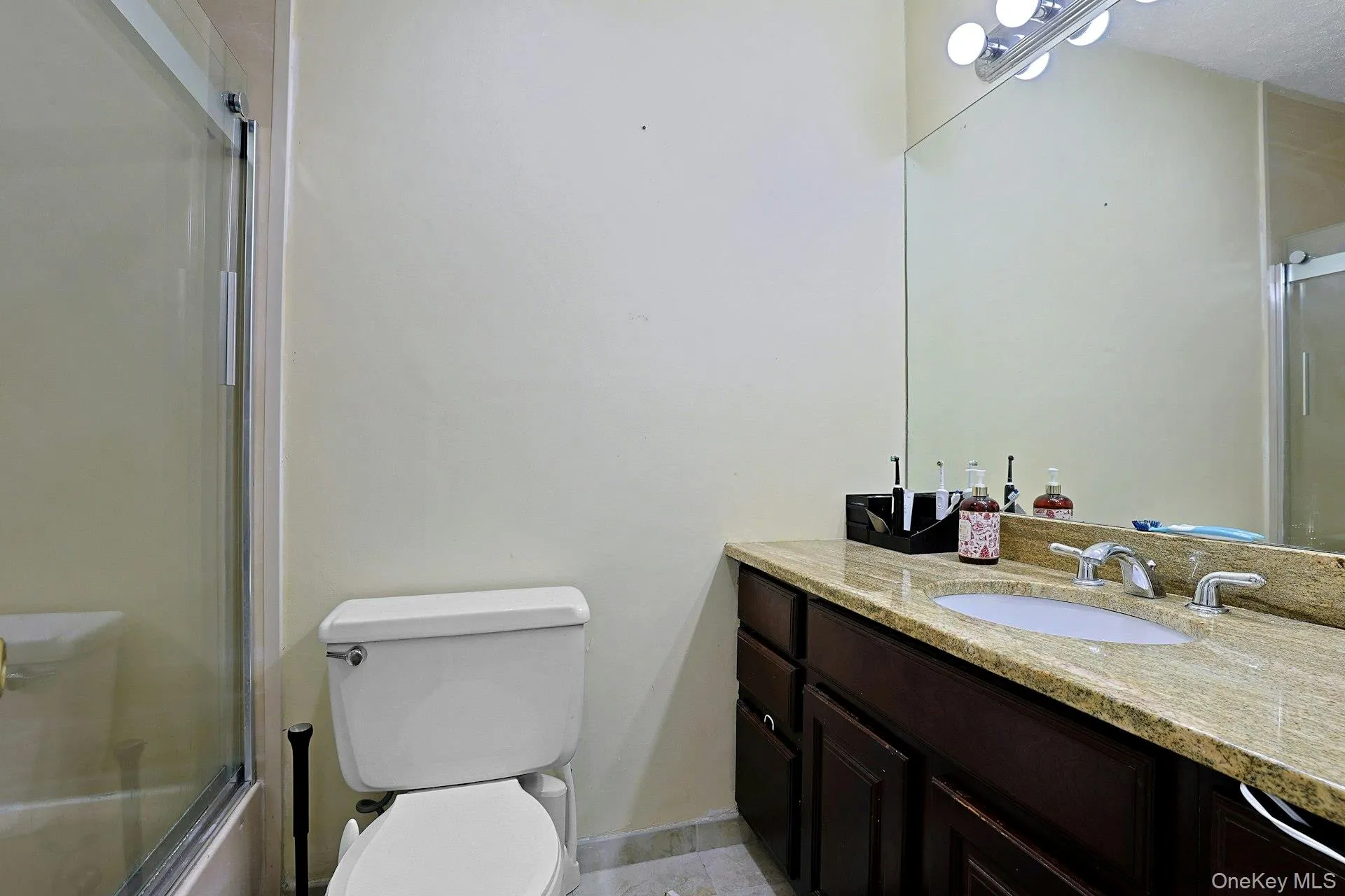 The updated, full hall bathroom with a sliding glass door on the tub is conveniently located next to the bedrooms. Also on the bedroom floor is the laundry hall closet. No need to go to a laundromat ever again! The updated, full hall bathroom with a sliding glass door on the tub is conveniently located next to the bedrooms. Also on the bedroom floor is the laundry hall closet. No need to go to a laundromat ever again!