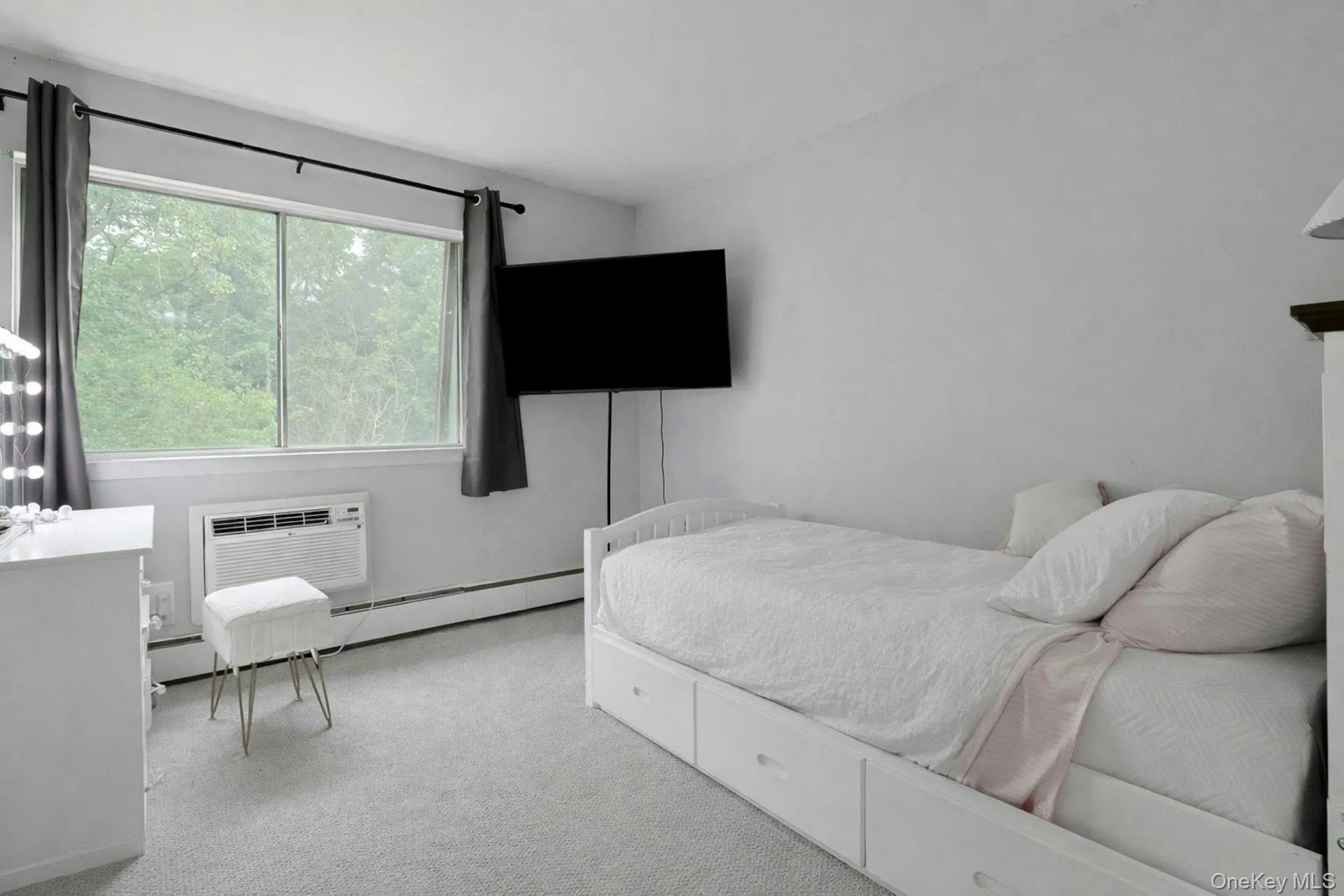 The good sized second bedroom. As in the other spaces in the home the in-wall air conditioner is a blessing in the summer. The good sized second bedroom. As in the other spaces in the home the in-wall air conditioner is a blessing in the summer.