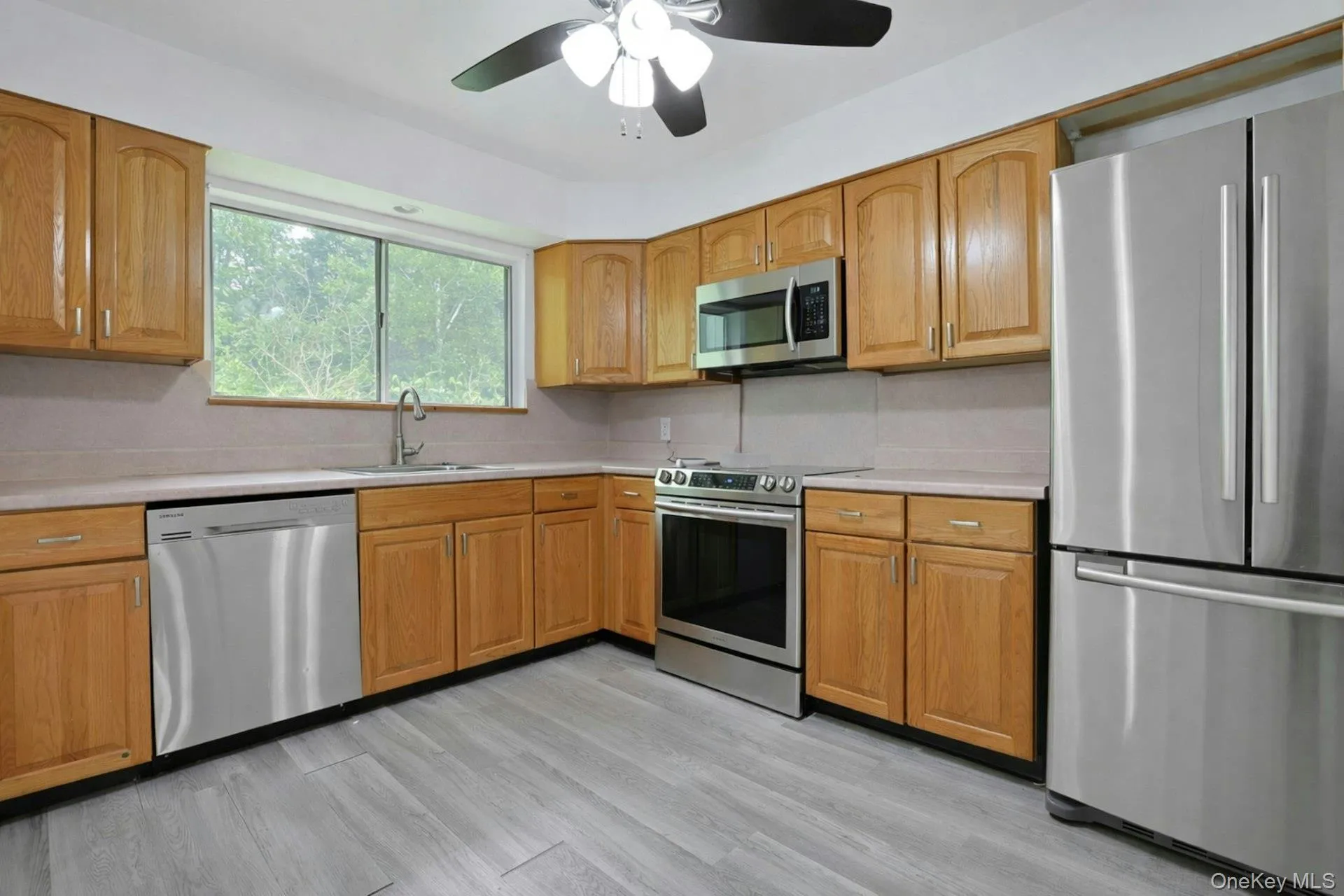 Open to the dining area, the updated kitchen, with stainless steel appliances, is a wonderful spot to prepare a meal. Open to the dining area, the updated kitchen, with stainless steel appliances, is a wonderful spot to prepare a meal.