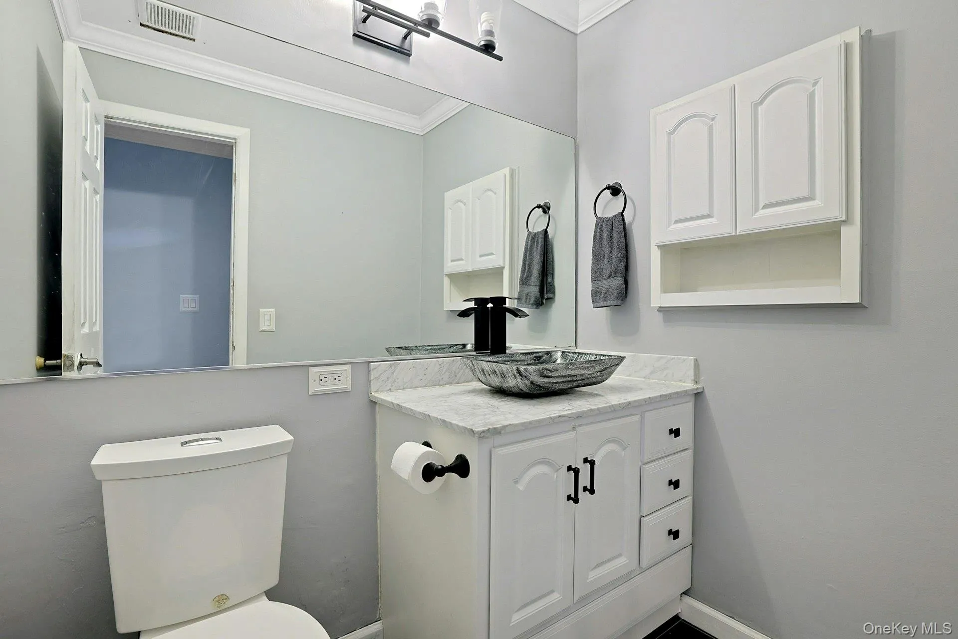 Also on the first floor is this updated half bathroom, with newer fixtures. Also on the first floor is this updated half bathroom, with newer fixtures.