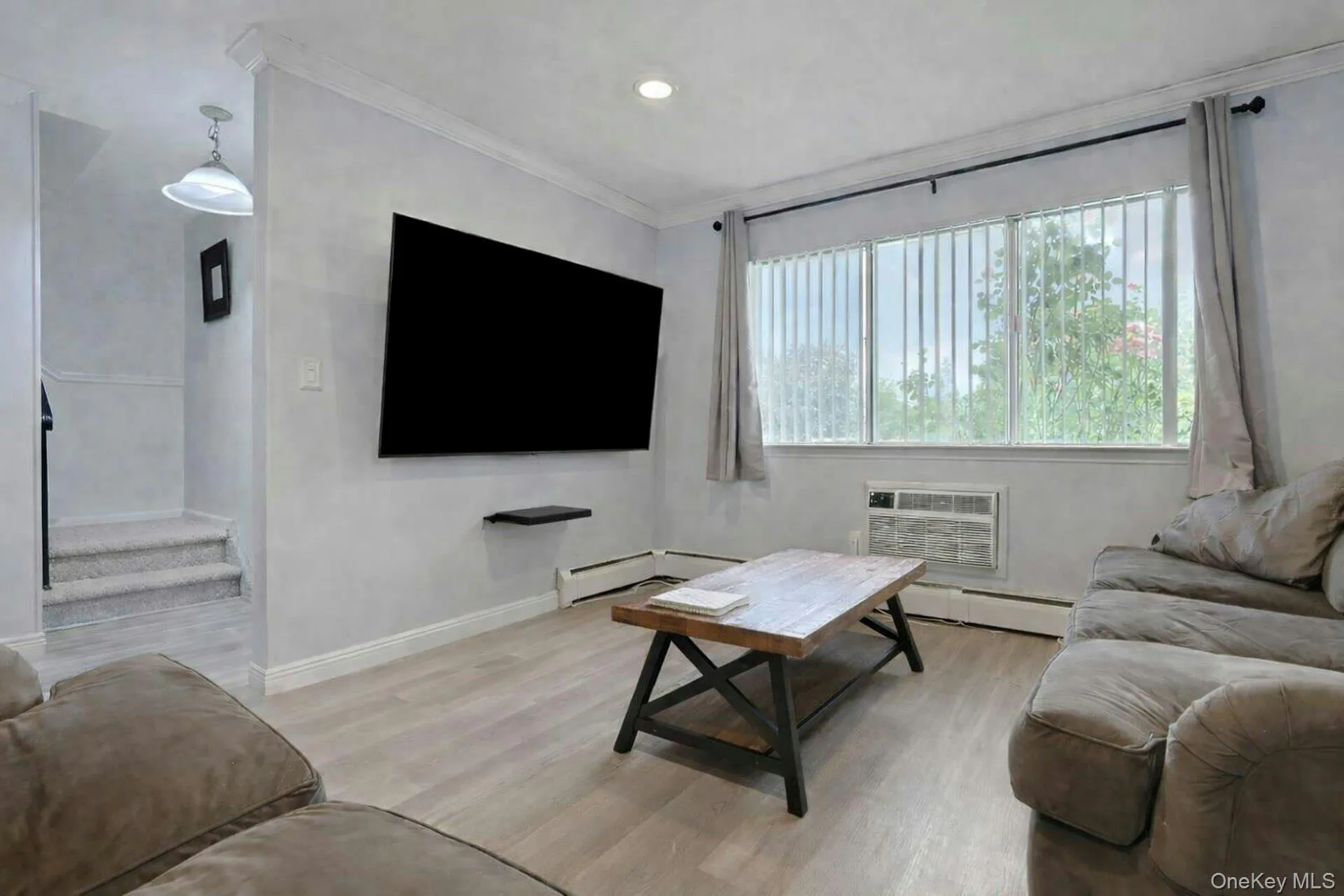 With easy to clean floors and plenty of overhead recessed lighting, the living room is a welcoming space. With easy to clean floors and plenty of overhead recessed lighting, the living room is a welcoming space.