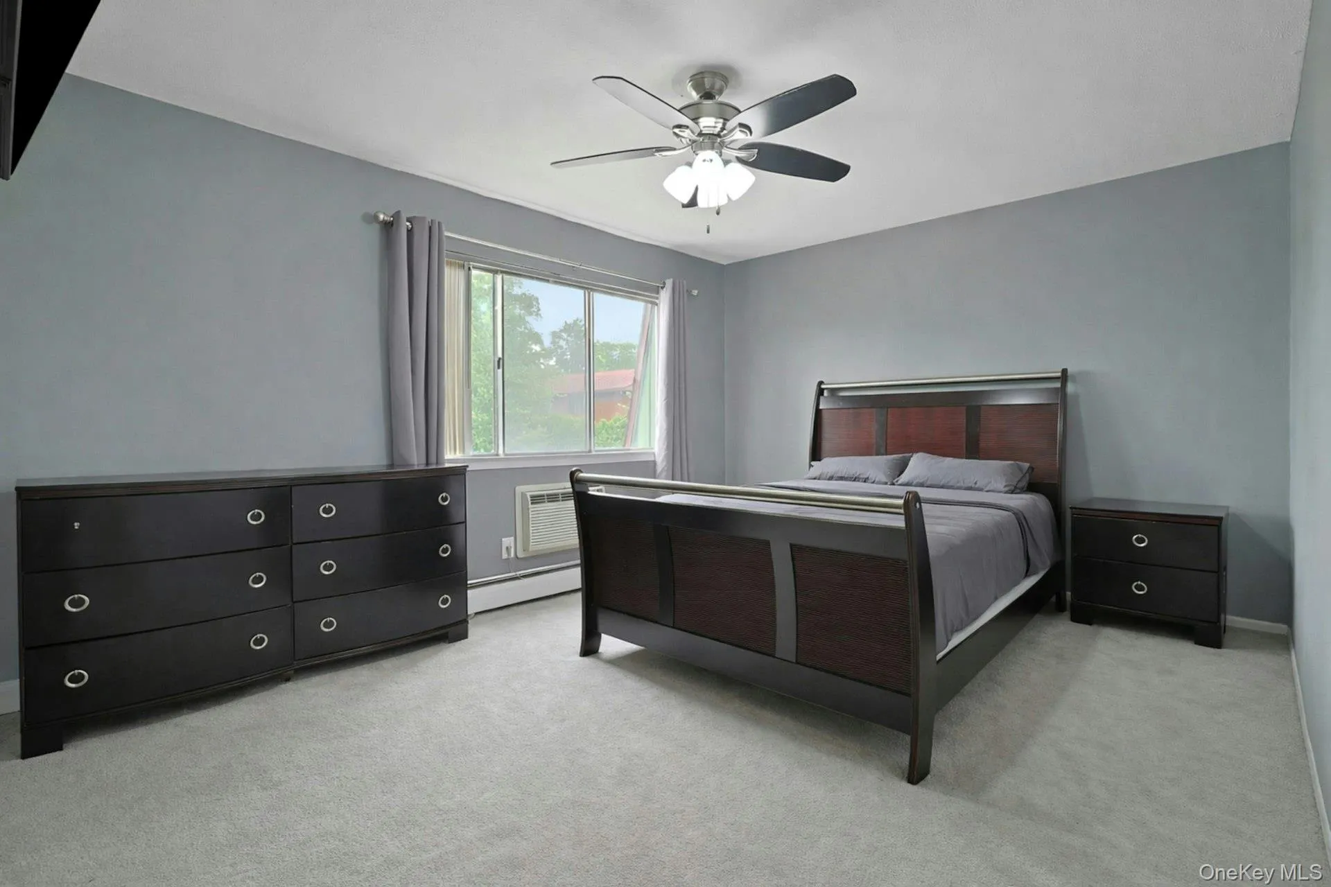 Upstairs, the largest of the three bedrooms has ample space for a king sized bed, as well as large closets and views out to the woods behind the house. Upstairs, the largest of the three bedrooms has ample space for a king sized bed, as well as large closets and views out to the woods behind the house.