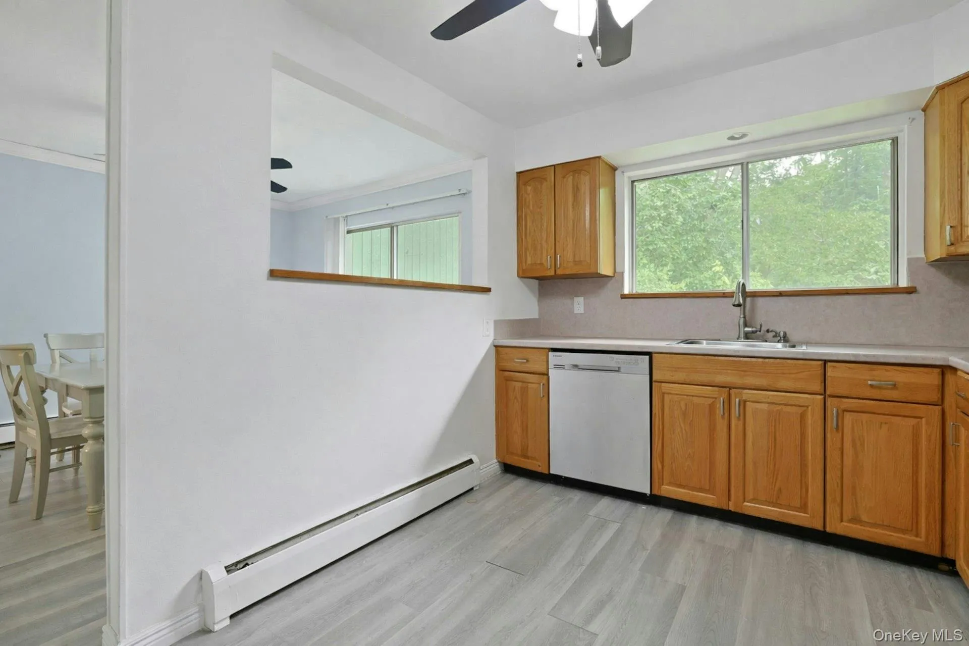 A large passthrough keeps the cook part of the conversation in the dining room, and makes bringing food in a breeze. A large passthrough keeps the cook part of the conversation in the dining room, and makes bringing food in a breeze.