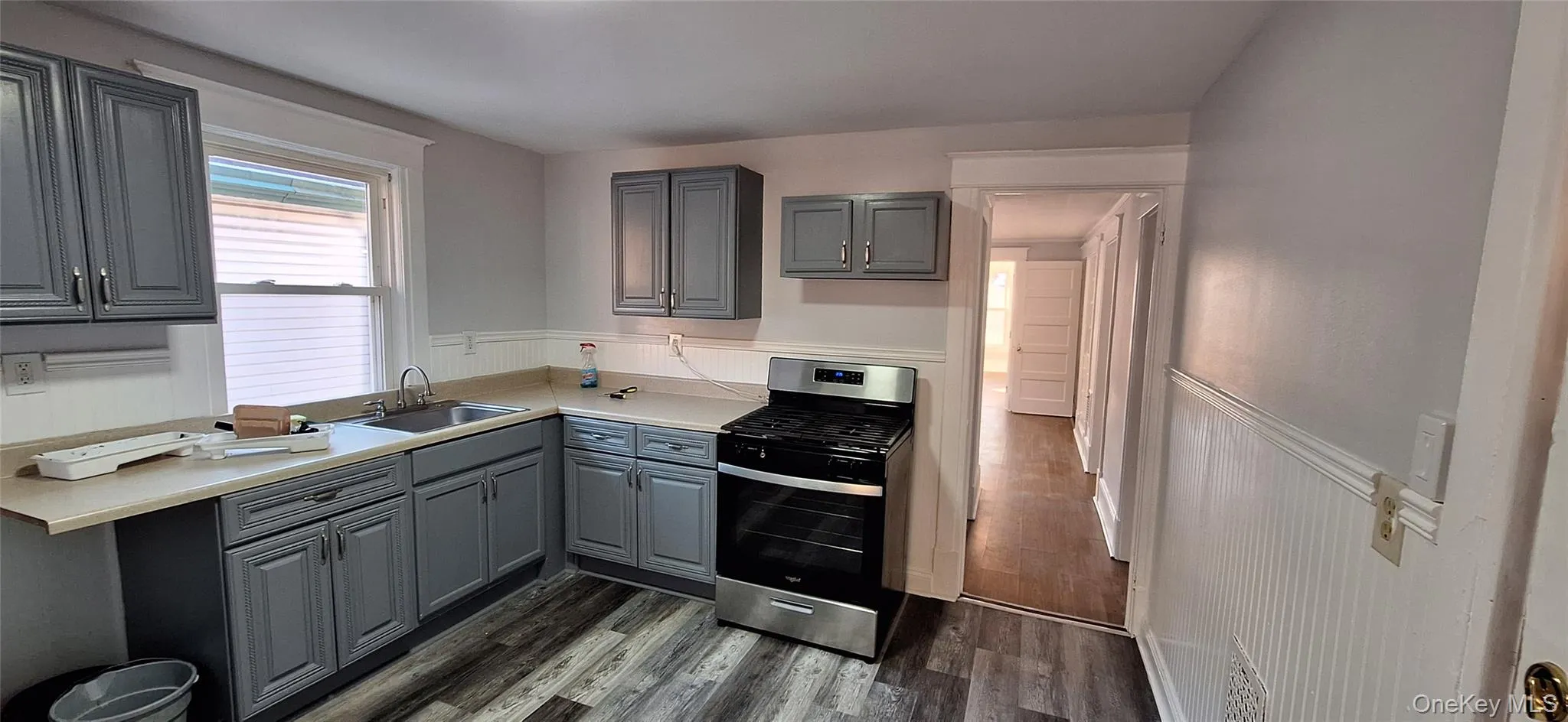 Kitchen with gray cabinetry, sink, and stainless steel range and Fridge Kitchen with gray cabinetry, sink, and stainless steel range and Fridge