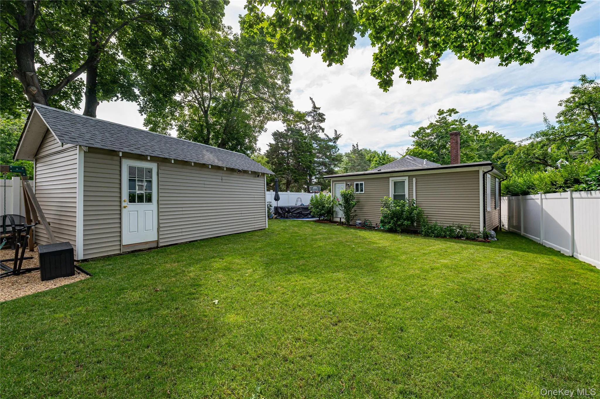 Back yard and garage Back yard and garage