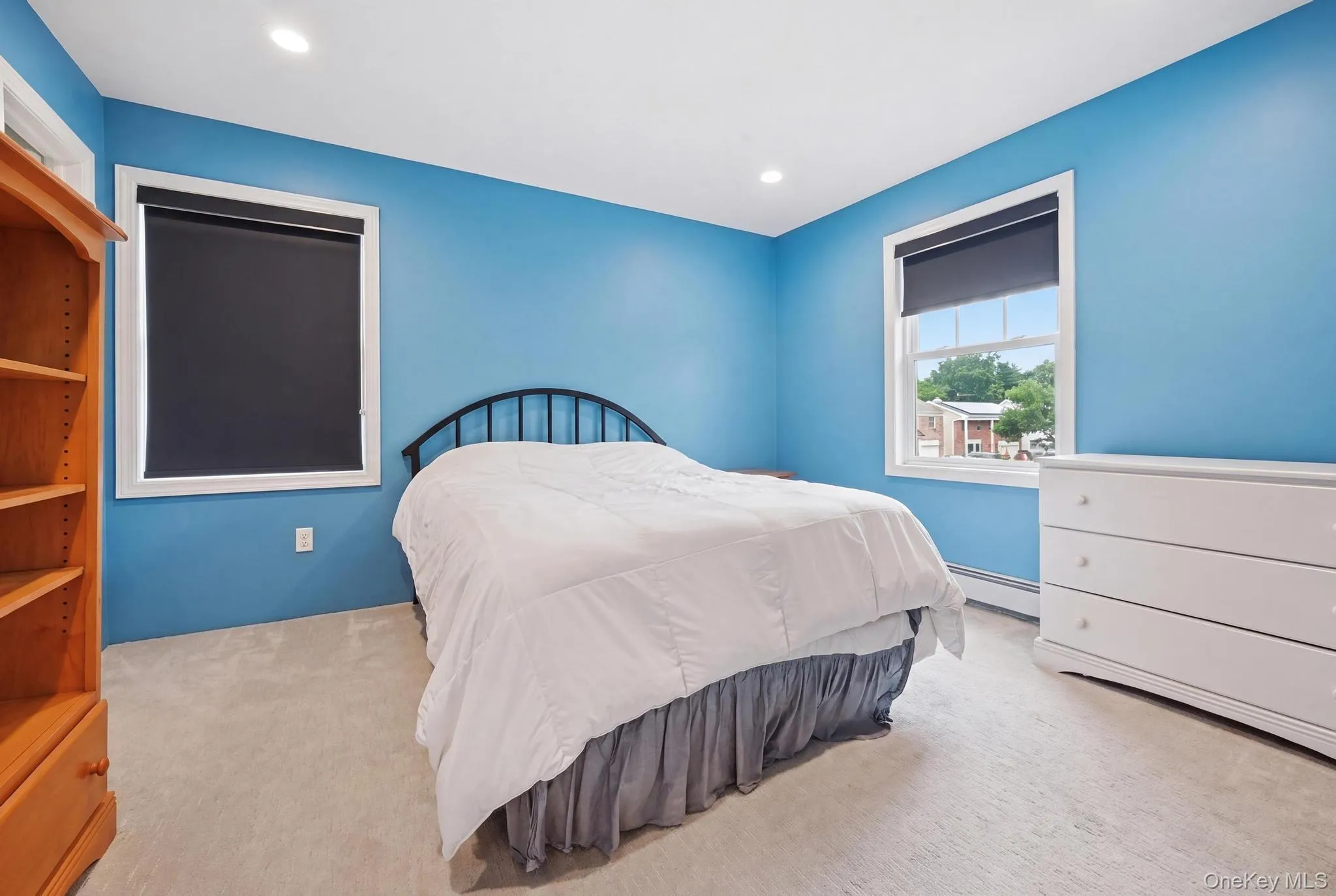 Carpeted room with recessed lighting and two windows Carpeted room with recessed lighting and two windows
