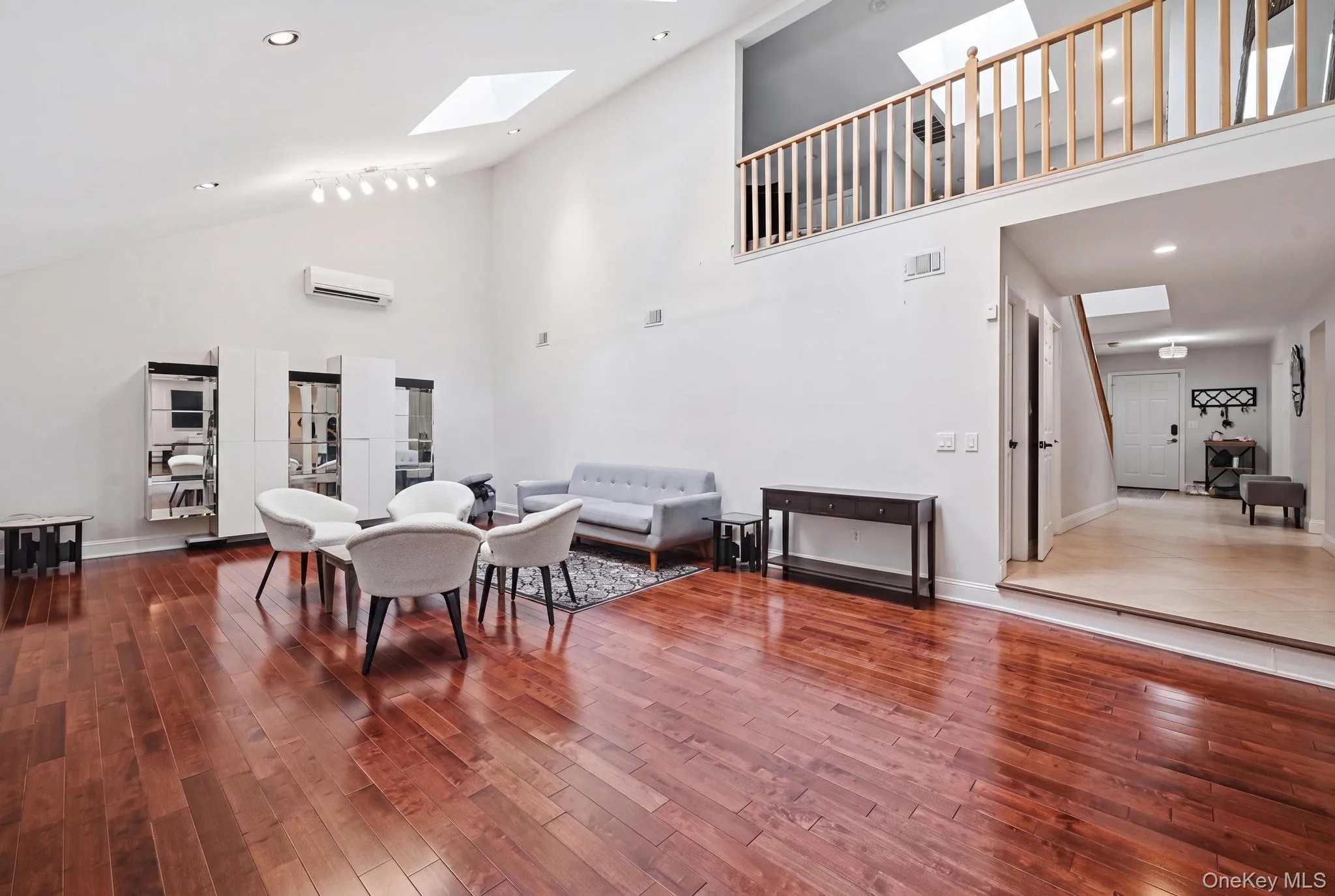 Vaulted ceilings with multiple skylights complement the warm wood-finish flooring Vaulted ceilings with multiple skylights complement the warm wood-finish flooring