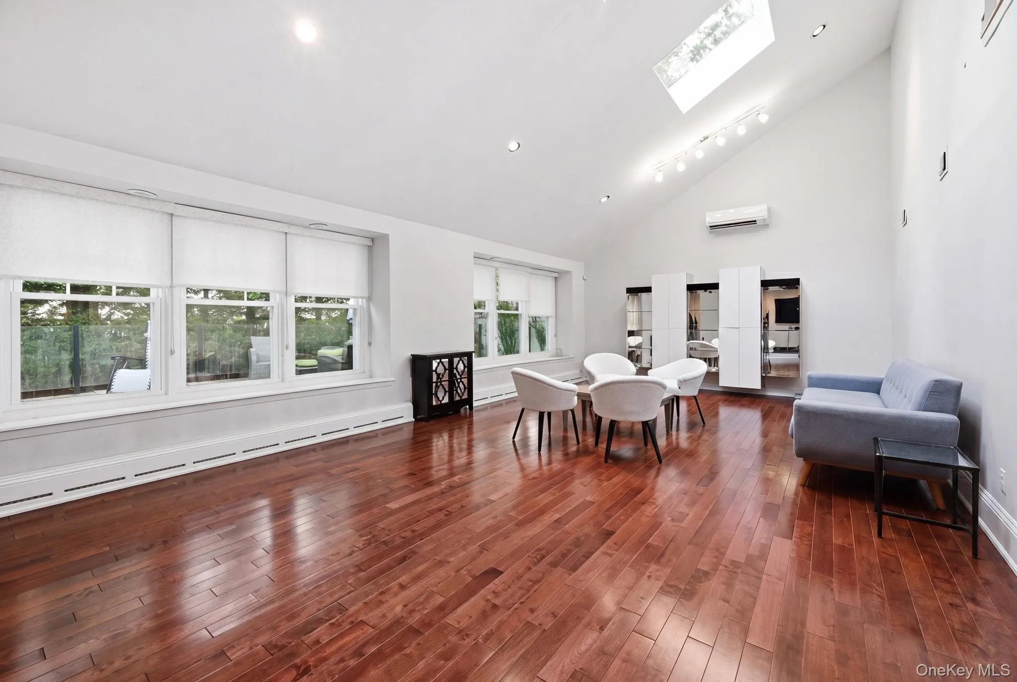 Vaulted ceilings with multiple skylights complement the warm wood-finish flooring Vaulted ceilings with multiple skylights complement the warm wood-finish flooring