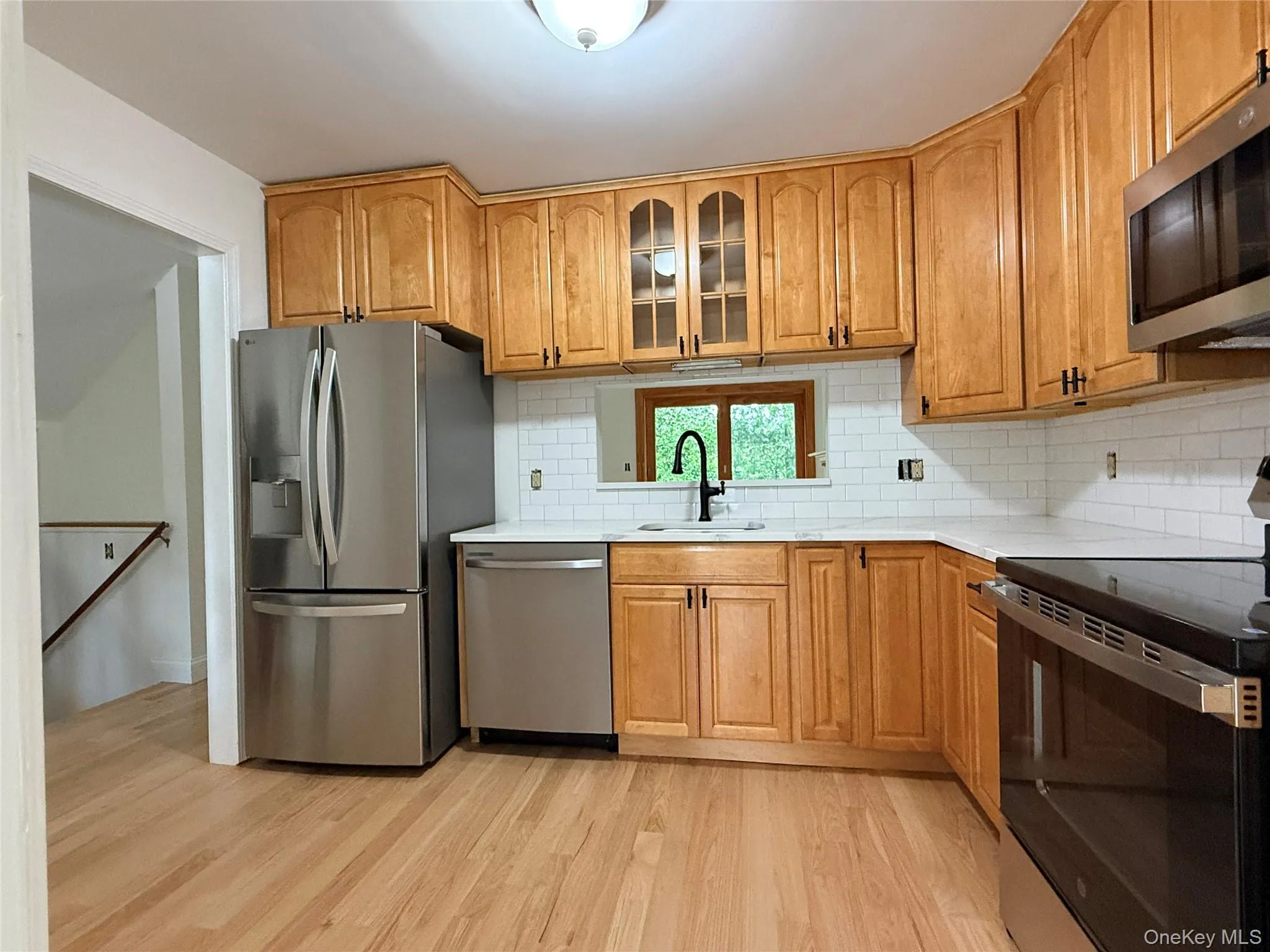 A bright, functional kitchen with stainless steel appliances, perfect for everyday cooking and entertaining. A bright, functional kitchen with stainless steel appliances, perfect for everyday cooking and entertaining.