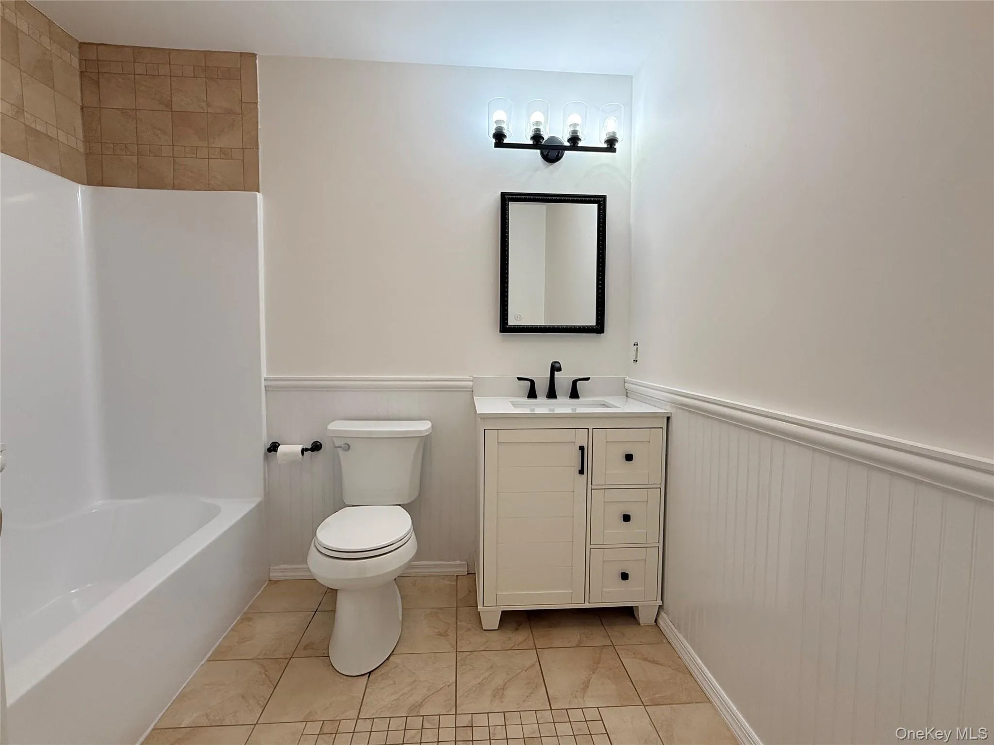 A beautifully bright full bathroom with fresh white finishes and a timeless, polished look A beautifully bright full bathroom with fresh white finishes and a timeless, polished look