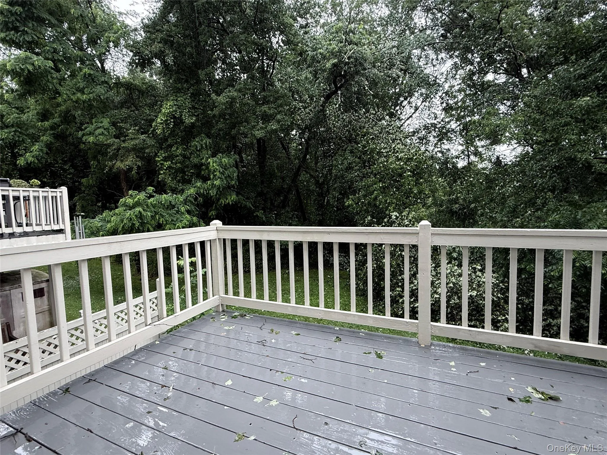 Step out onto the deck and enjoy peaceful views of the private wooded surroundings. Step out onto the deck and enjoy peaceful views of the private wooded surroundings.