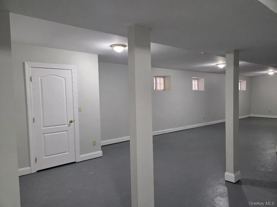 Basement featuring baseboards Basement featuring baseboards