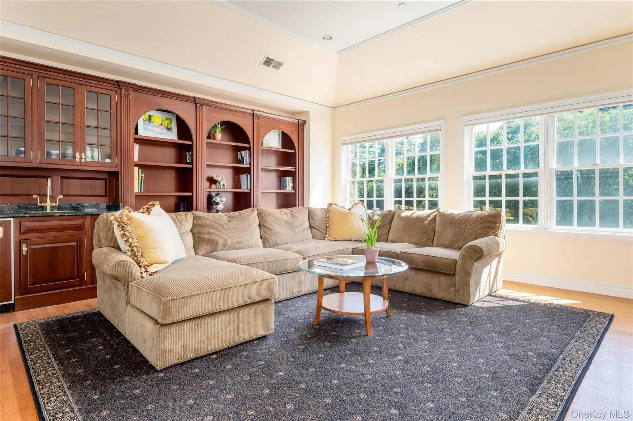 Primary sitting Room with custom builtins and coffee bar Primary sitting Room with custom builtins and coffee bar