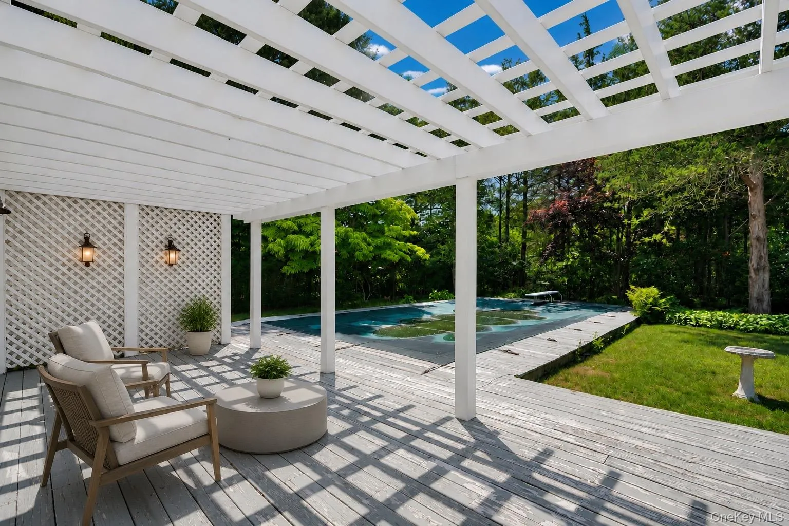 Patio overlooking the pool (Virtually Staged) Patio overlooking the pool (Virtually Staged)