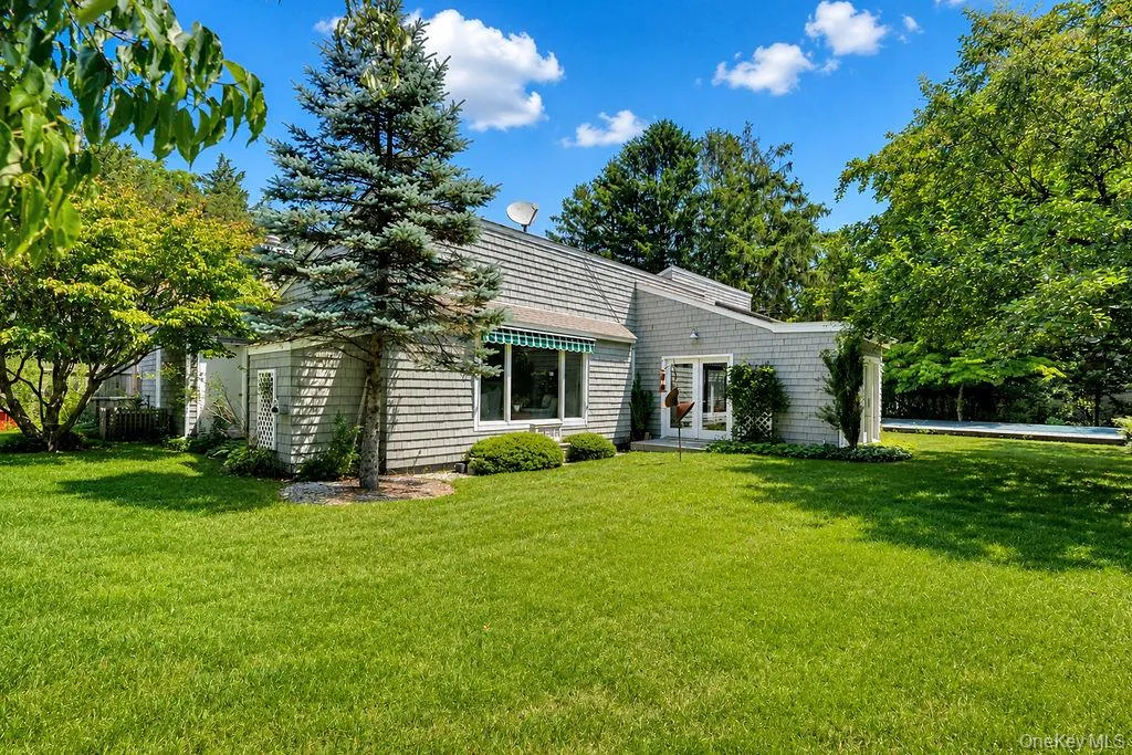 Home surrounded by mature landscaping Home surrounded by mature landscaping