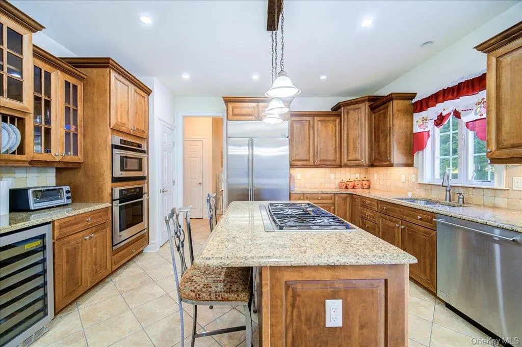 with granite countertops and stainless steel appliances; Wine cooler or used for beverages. with granite countertops and stainless steel appliances; Wine cooler or used for beverages.