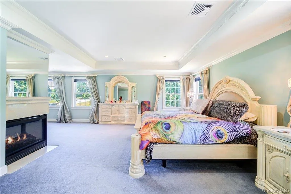 Large Primary Bedroom with Double-sided fireplace and Master Suite Wet Bar. Tray ceilings with sitting area for relaxing. Lots of windows fnatural sunlight. Large Primary Bedroom with Double-sided fireplace and Master Suite Wet Bar. Tray ceilings with sitting area for relaxing. Lots of windows fnatural sunlight.