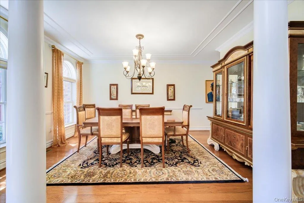 Large Diningroom with hardwood floors and huge windows from top to floor. Large Diningroom with hardwood floors and huge windows from top to floor.